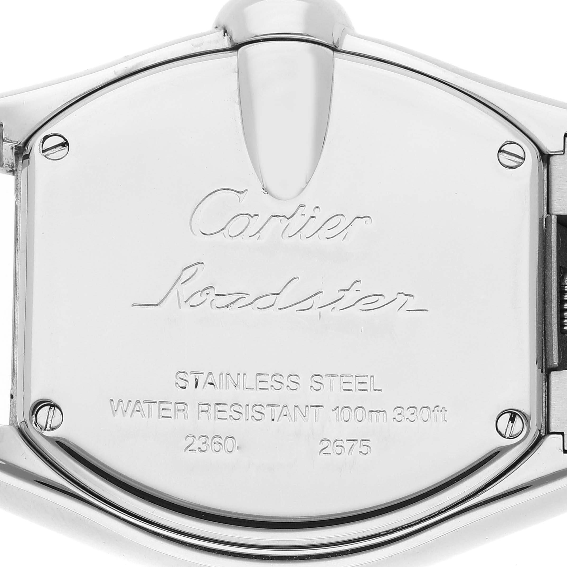 The image shows the back case of a Cartier Roadster W62016V3 Women
s Stainless Steel Silver Dial W62016V3 Women
s Stainless Steel Silver Dial watch, highlighting engravings and screws.