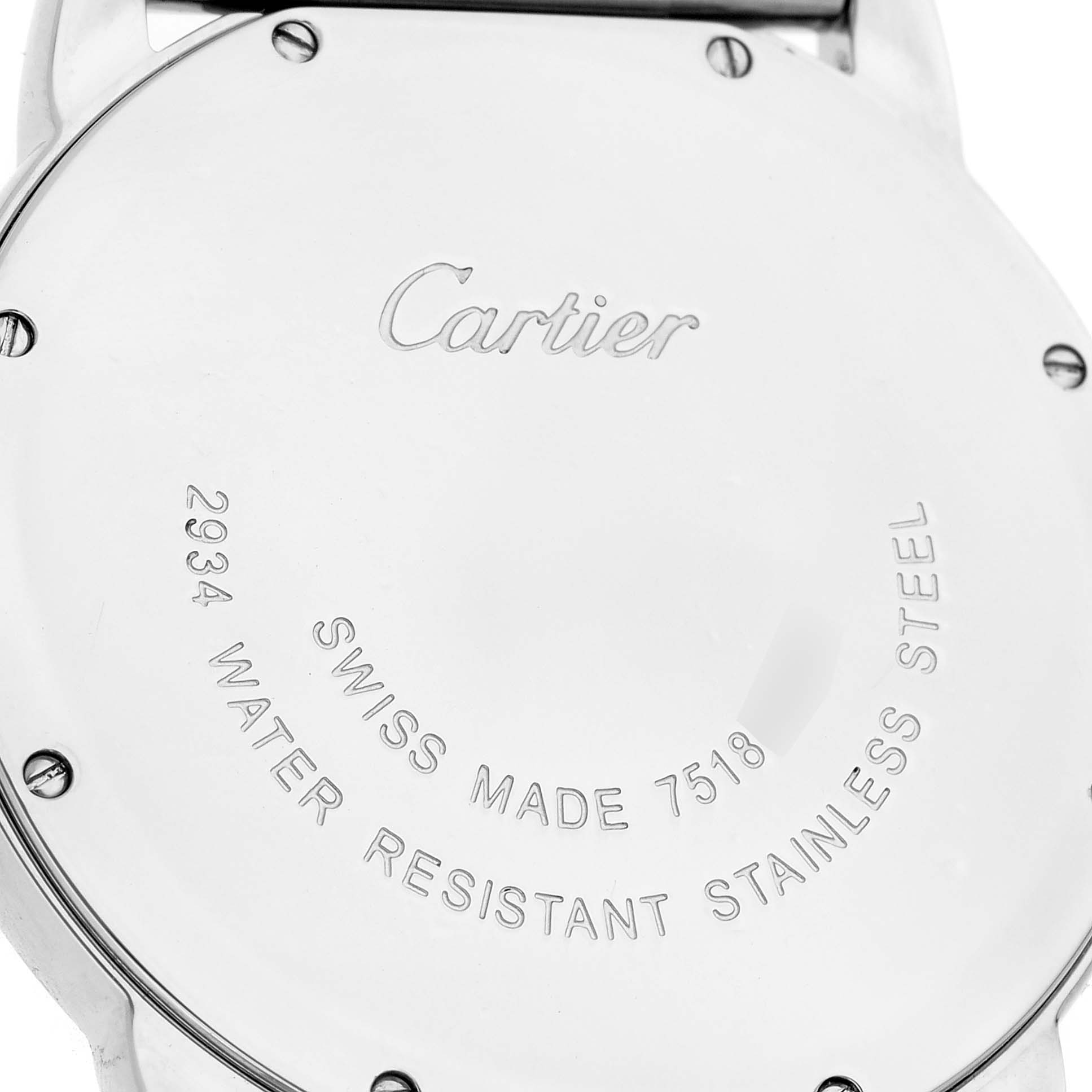 The image shows the back case of a Cartier Ronde W6701005 Men's Stainless Steel Silver Dial watch, displaying its engravings and screws.
