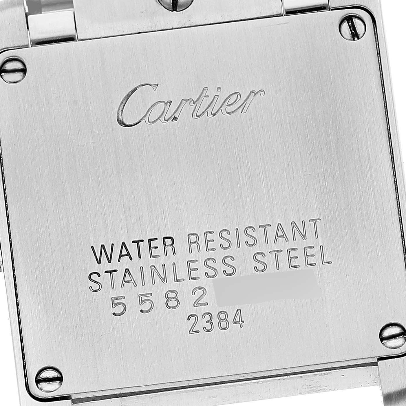 The image shows the back case of a Tank Francaise model by Cartier with engraved specifications.