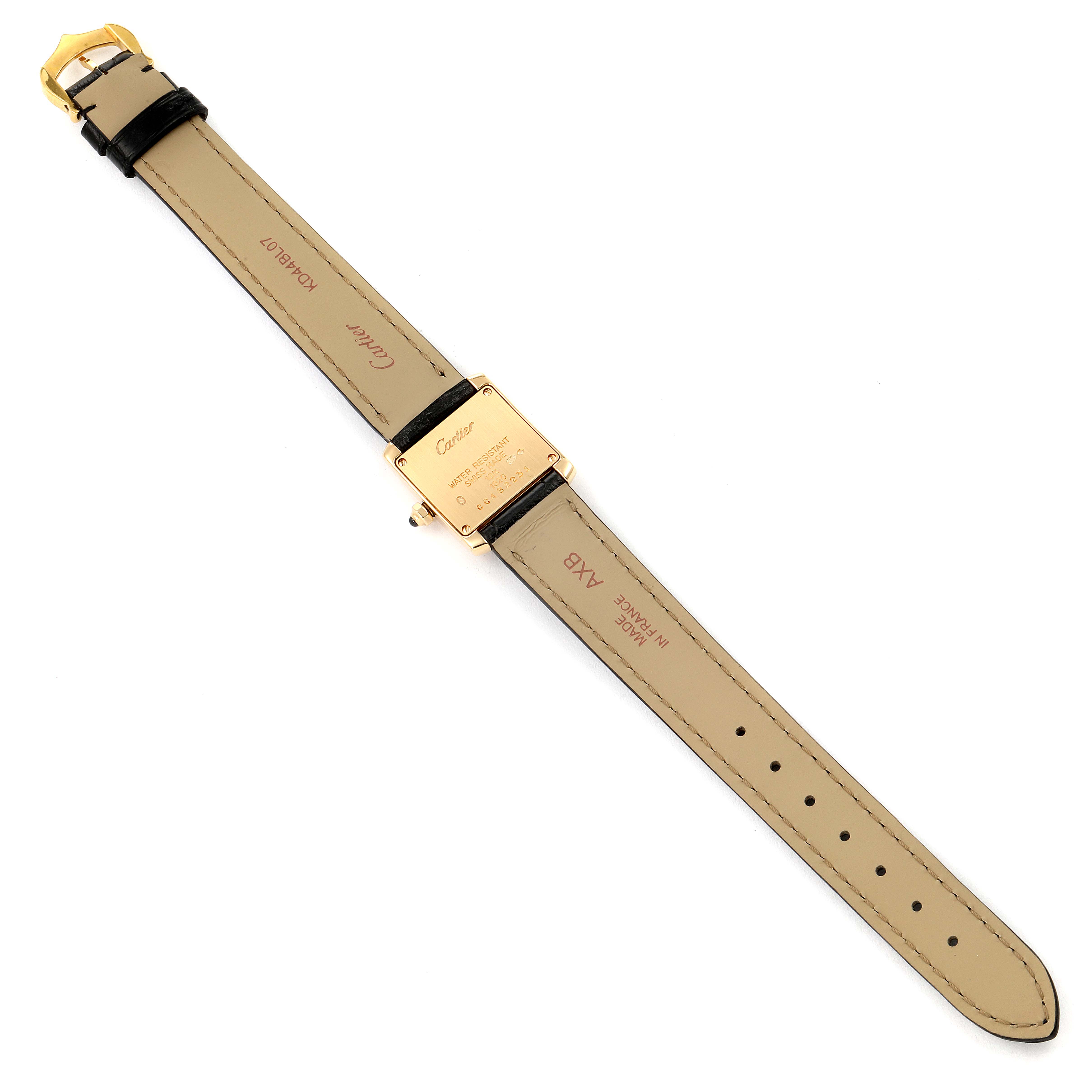 The image shows the back and strap of a Cartier Tank Française watch, highlighting the buckle, leather strap, and case back.