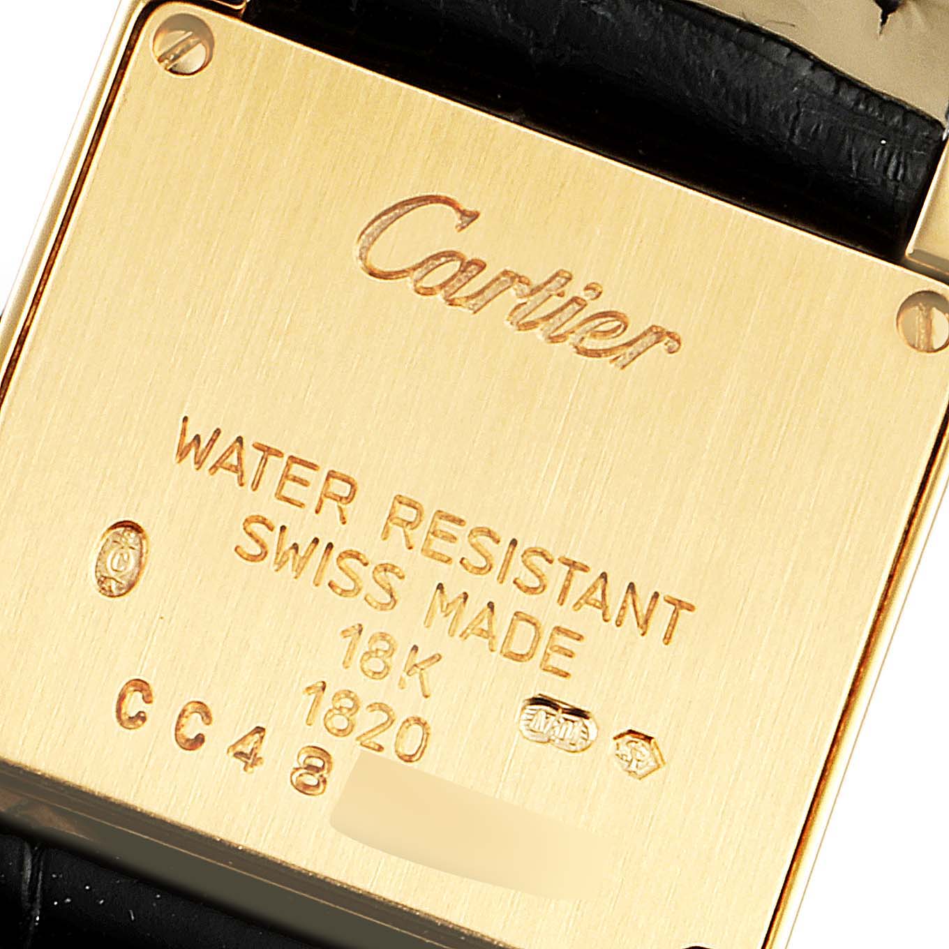 This image shows the case back of a Tank Francaise model by Cartier, highlighting its inscriptions and markings.