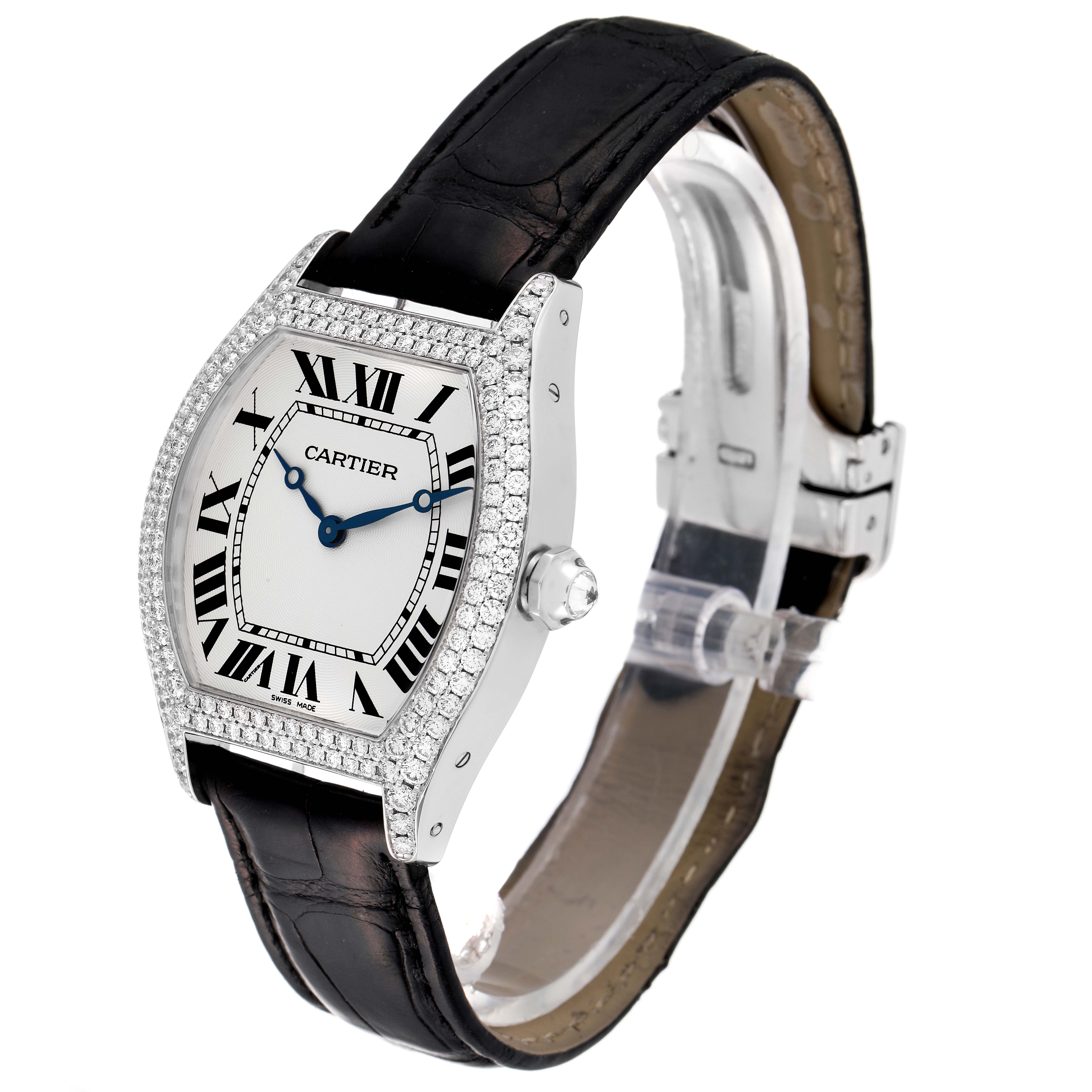 The Cartier Tortue WA503851 Men
s White Gold Silver Dial WA503851 Men
s White Gold Silver Dial watch is shown from an angled side view, highlighting its diamond-studded bezel, dial, and leather strap.