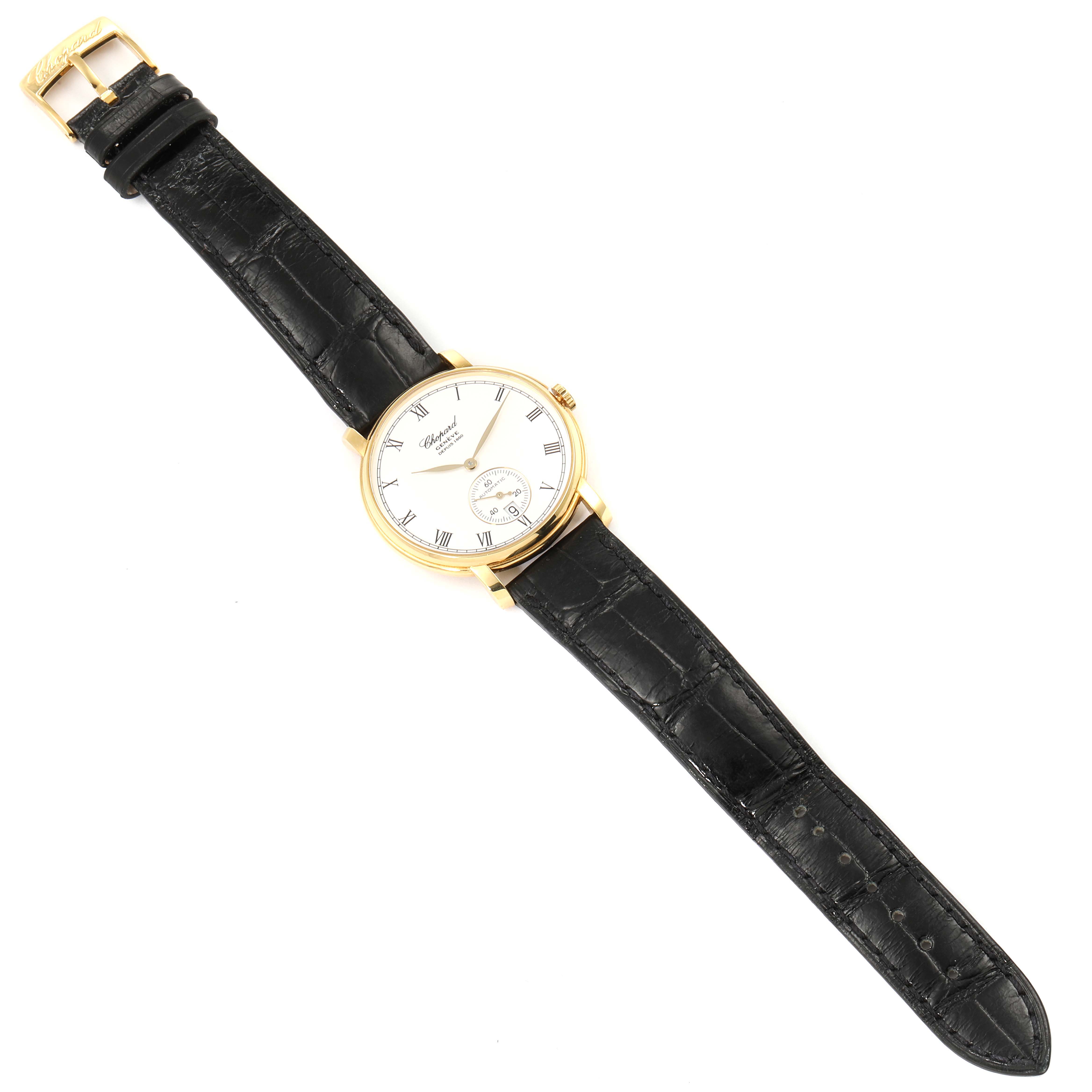 The Chopard Classique 16/1223 Men's Yellow Gold White Dial 16/1223 Men's Yellow Gold White Dial watch is shown from a top-down angle, displaying the full face, black leather strap, and gold buckle.