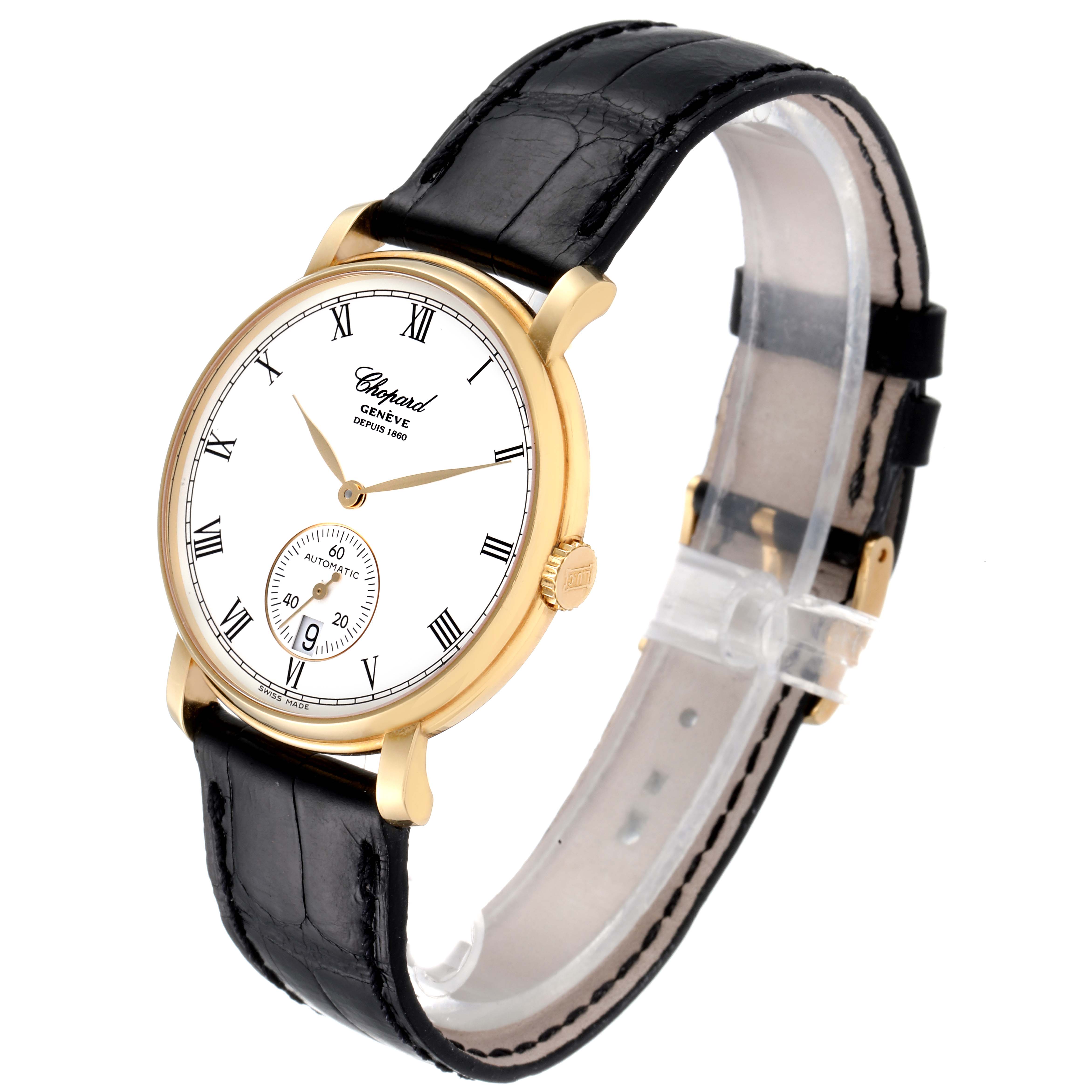 The Chopard Classique 16/1223 Men's Yellow Gold White Dial 16/1223 Men's Yellow Gold White Dial watch is shown at a slight angle from above, displaying its face, black strap, and gold casing.