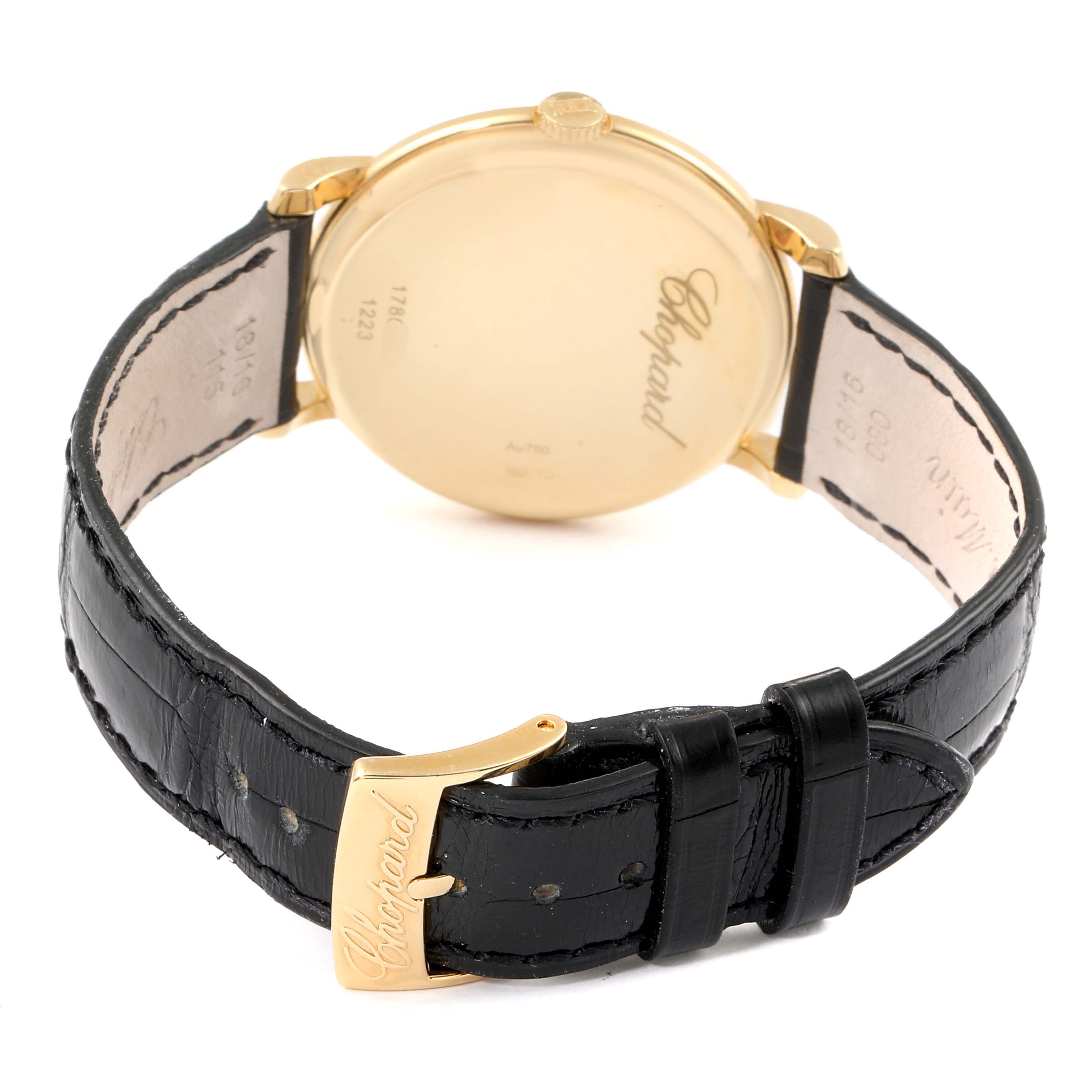 The image shows the back of a Chopard Classique 16/1223 Men's Yellow Gold White Dial 16/1223 Men's Yellow Gold White Dial watch with a black leather strap and gold buckle.