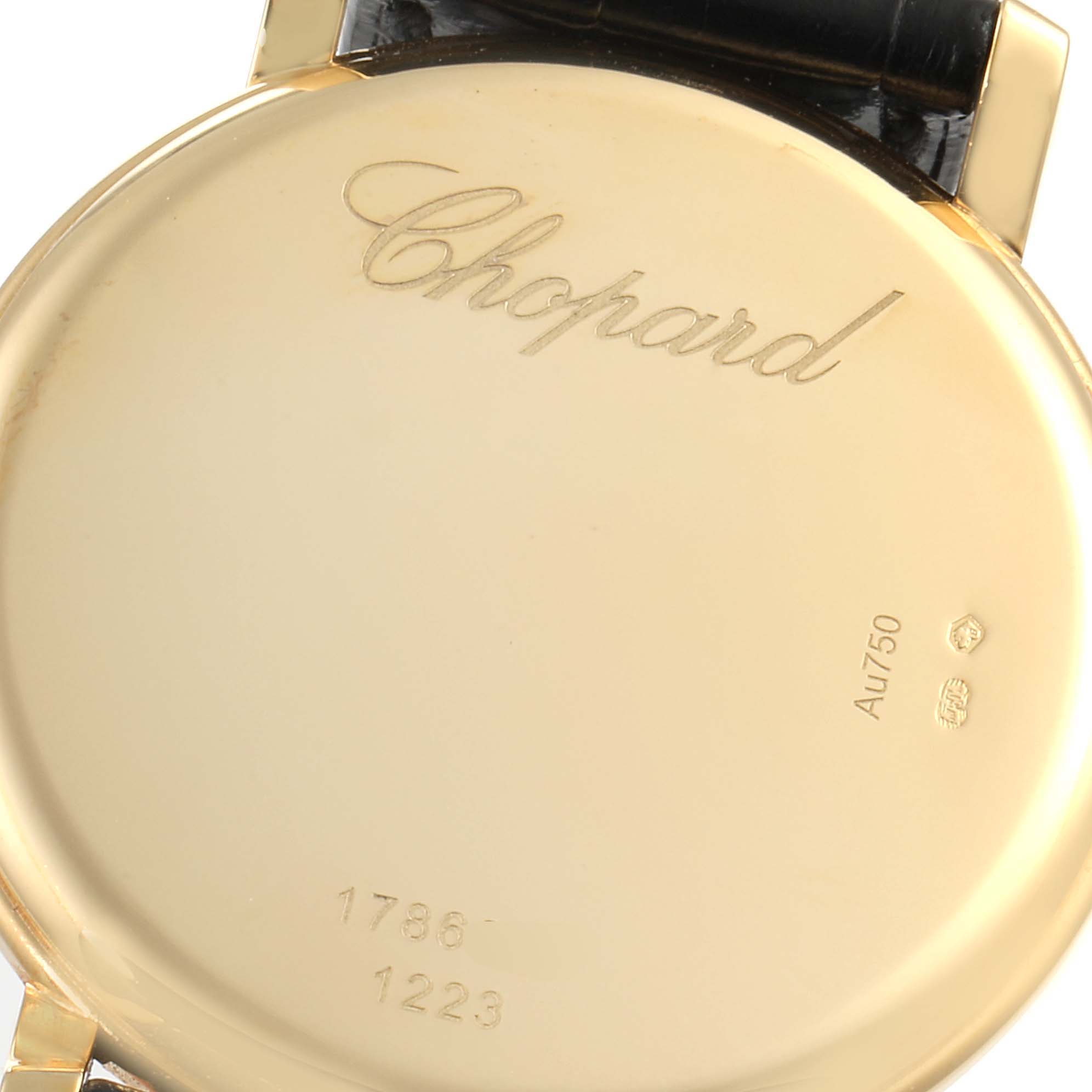 This image shows the back of a Chopard Classique 16/1223 Men's Yellow Gold White Dial 16/1223 Men's Yellow Gold White Dial watch with its brand engraving and model numbers visible.