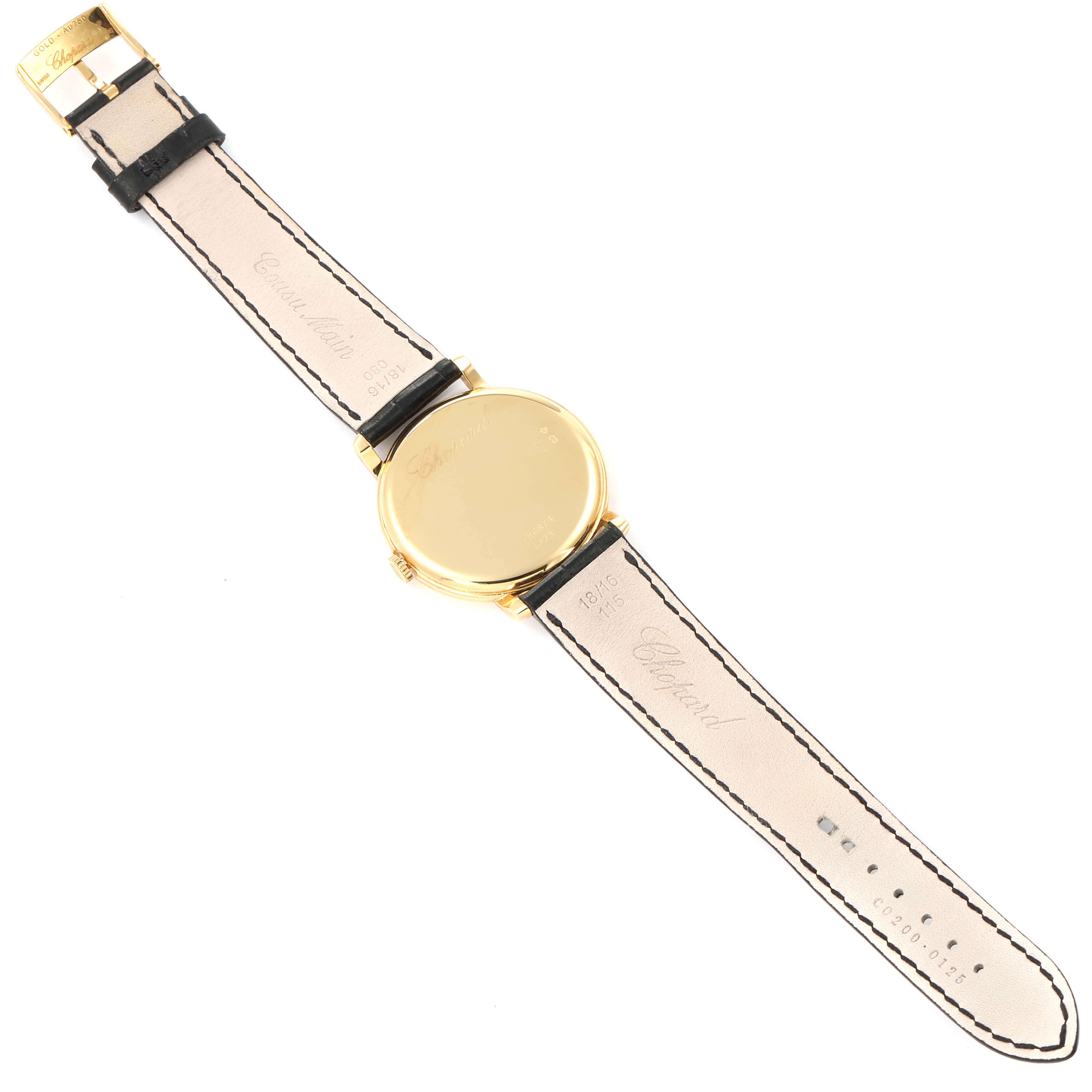 The image shows the back and strap of the Chopard Classique 16/1223 Men's Yellow Gold White Dial 16/1223 Men's Yellow Gold White Dial model watch laid flat, highlighting the clasp, case back, and leather strap.