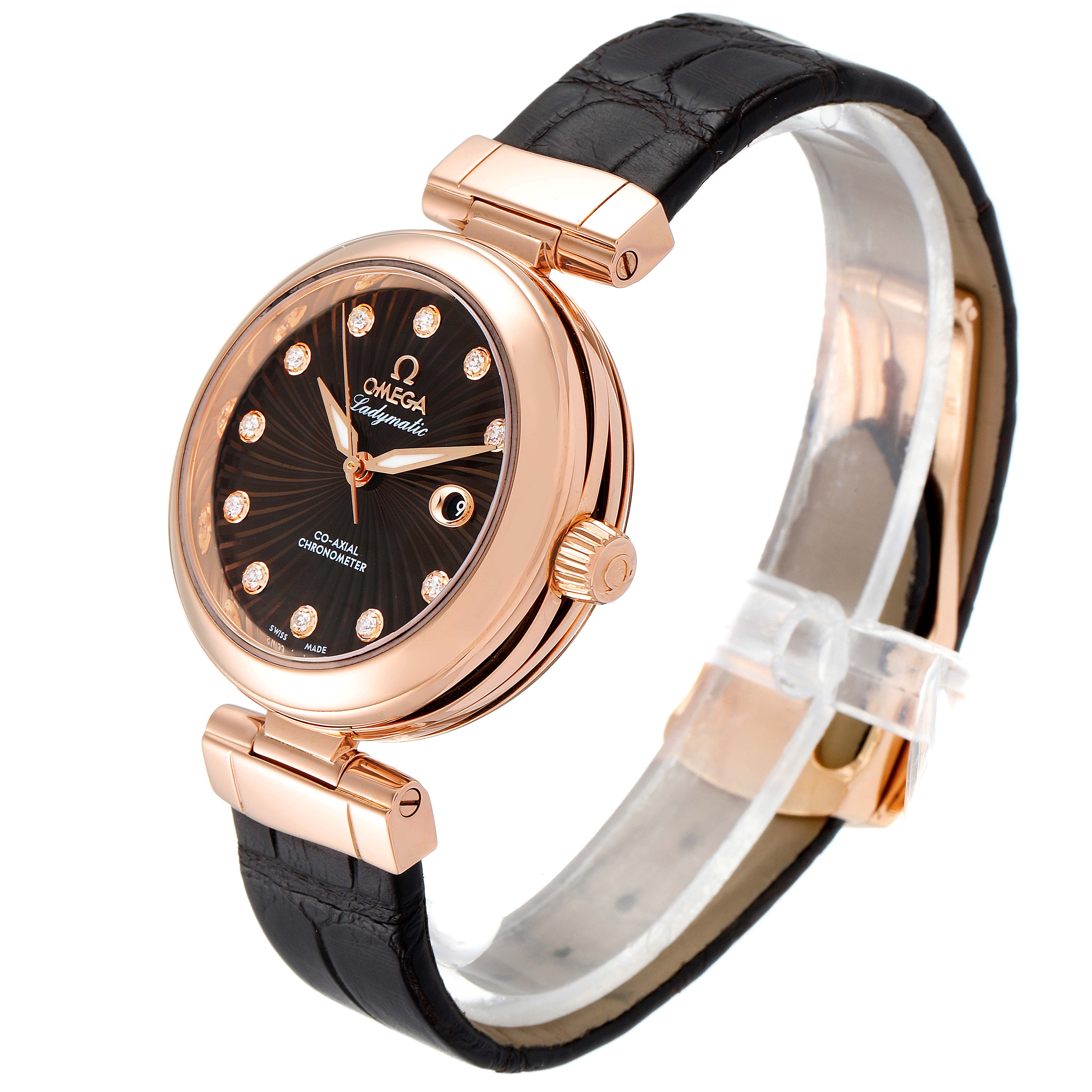 The image shows an angled view of the Omega 425.63.34.20.63.001 Women's Rose Gold Brown Dial 425.63.34.20.63.001 Women's Rose Gold Brown Dial DeVille Ladymatic Rose Gold Diamond Ladies Watch 425.63.34.20.63.001, featuring the dial and strap.