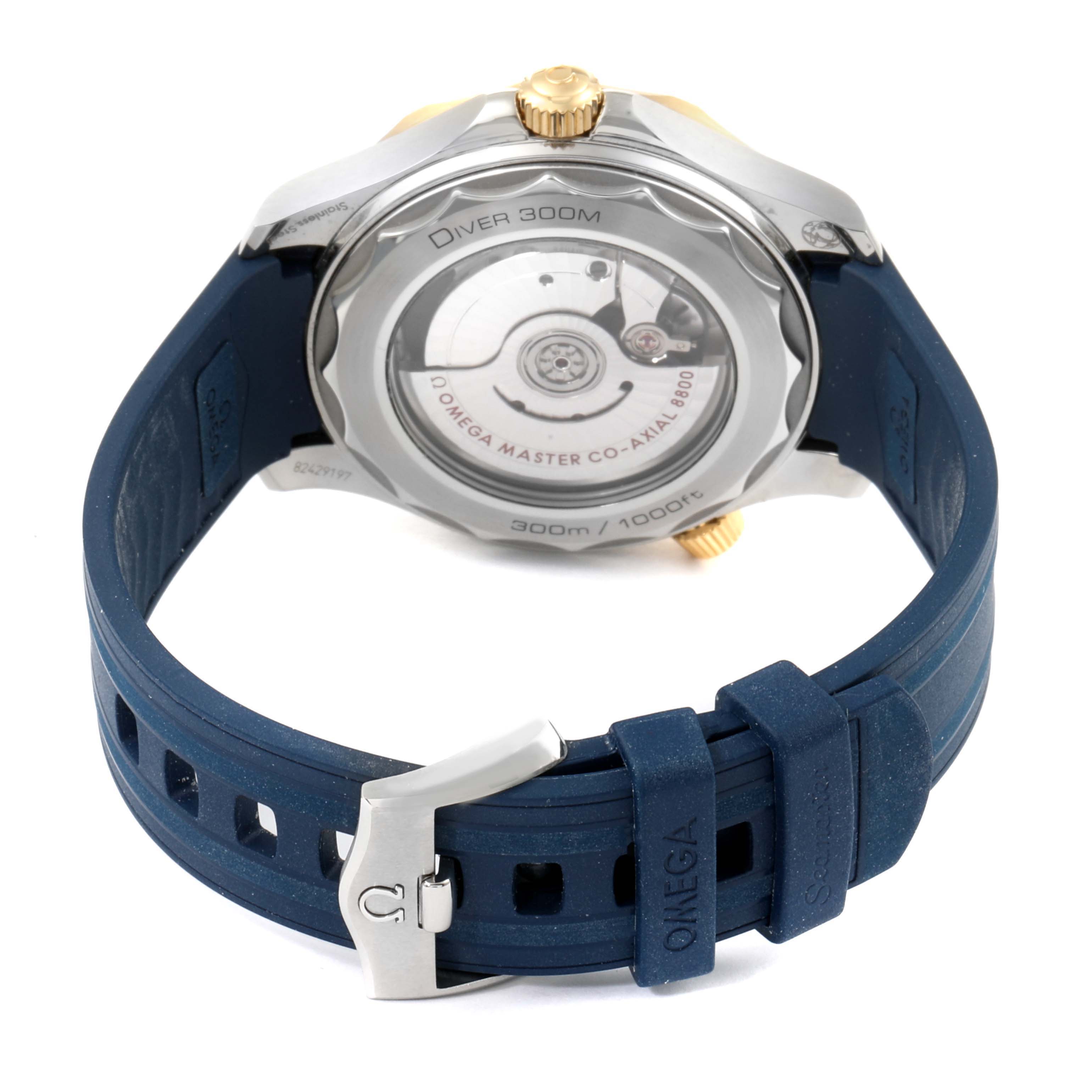 The image shows the back case and strap of an Omega Seamaster 210.22.42.20.03.001 Men's Steel and Gold (two tone) Blue Dial 210.22.42.20.03.001 Men's Steel and Gold (two tone) Blue Dial Diver 300M watch, including the visible movement and clasp.