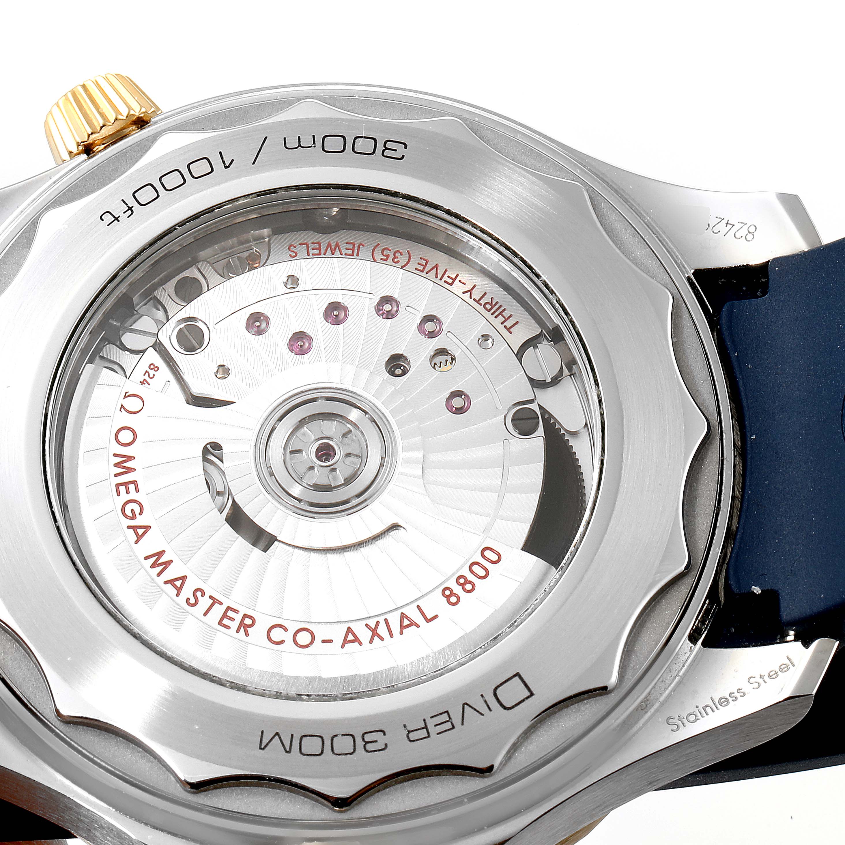 This image shows the back view of the Omega Seamaster 210.22.42.20.03.001 Men's Steel and Gold (two tone) Blue Dial 210.22.42.20.03.001 Men's Steel and Gold (two tone) Blue Dial watch, showcasing its movement and water resistance details.