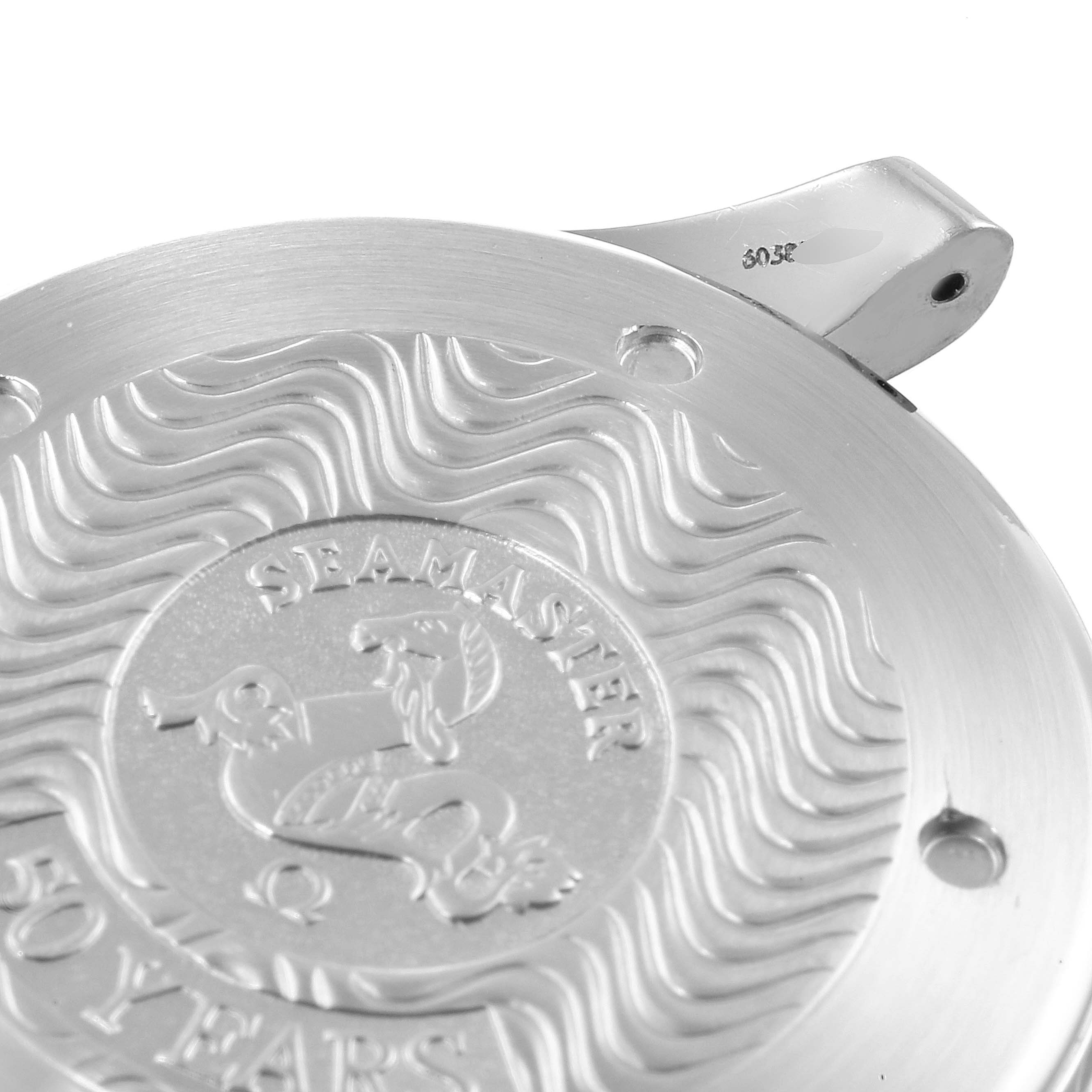 The image shows the caseback of an Omega Seamaster 2534.50.00 Men
s Stainless Steel Black Dial 2534.50.00 Men
s Stainless Steel Black Dial watch, featuring the "50 Years" engraving and wave pattern.