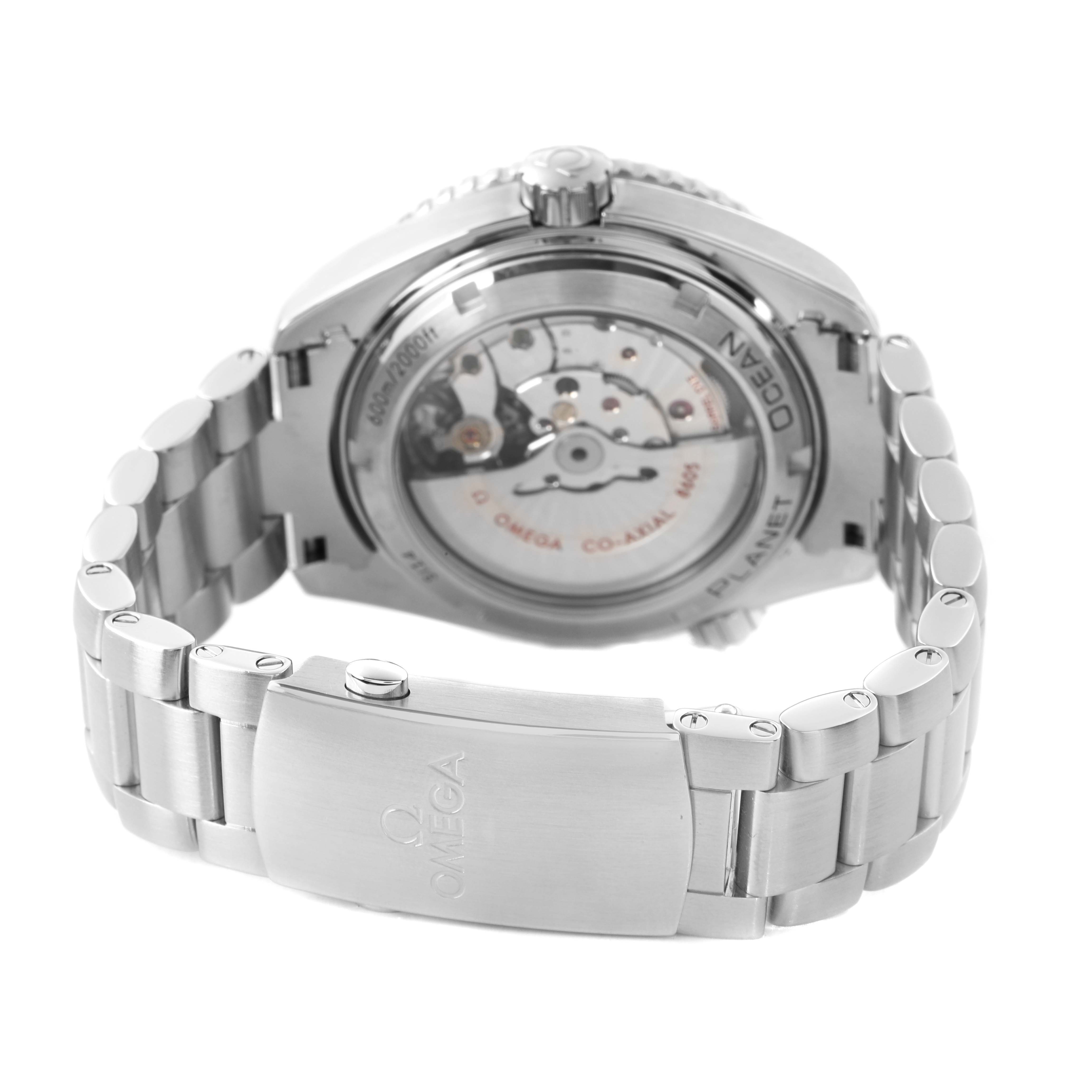 The image shows the back view of the Omega Planet Ocean 232.30.44.22.01.002 Men's Stainless Steel Black Dial watch, highlighting the transparent case back and metal bracelet clasp.