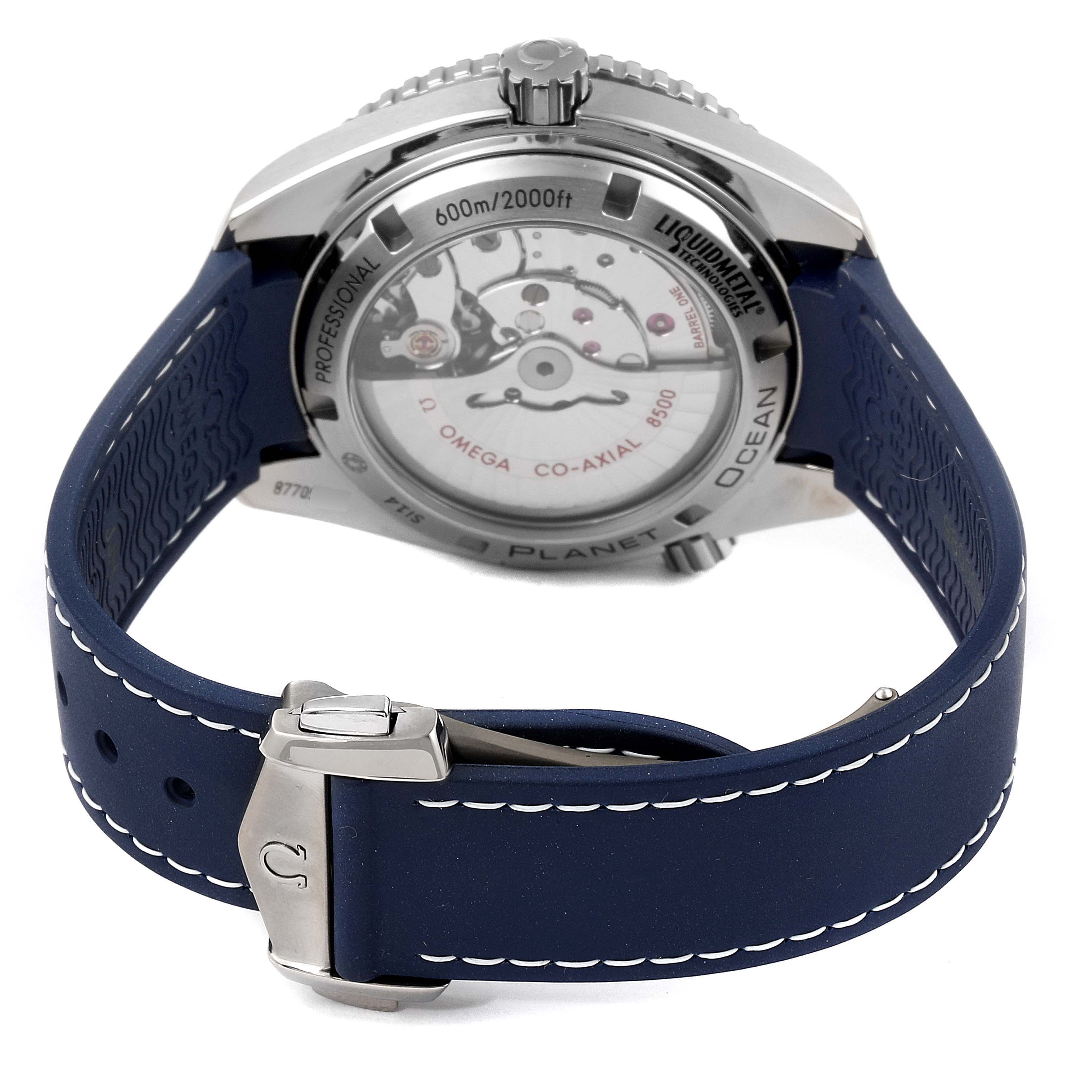The image shows the back of an Omega Planet Ocean 232.92.42.21.03.001 Men's Stainless Steel Blue Dial 232.92.42.21.03.001 Men's Stainless Steel Blue Dial watch, displaying its movement and blue strap with a clasp.