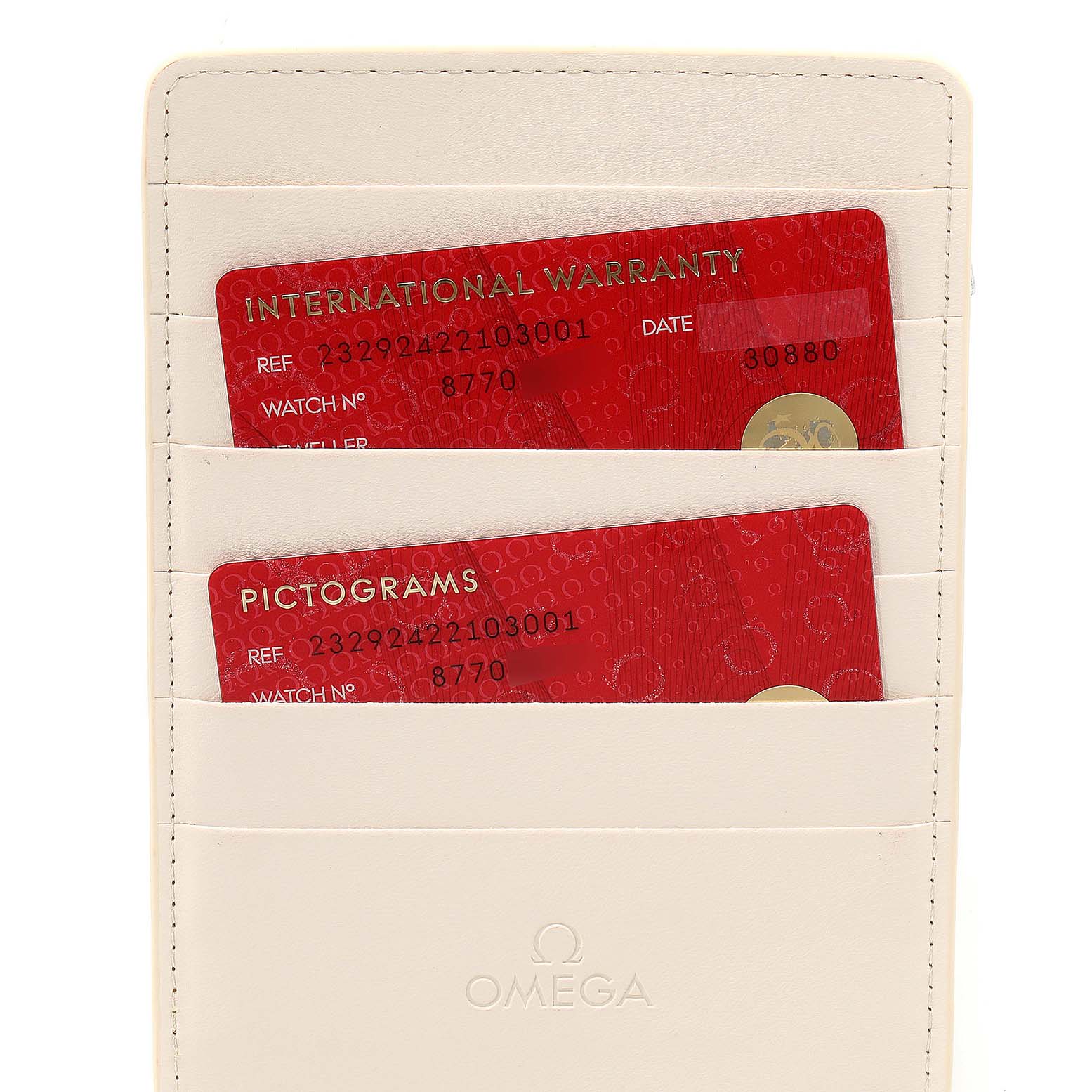 The image shows warranty and pictogram cards for the Omega Planet Ocean 232.92.42.21.03.001 Men's Stainless Steel Blue Dial 232.92.42.21.03.001 Men's Stainless Steel Blue Dial model, placed inside a cream-colored cardholder.