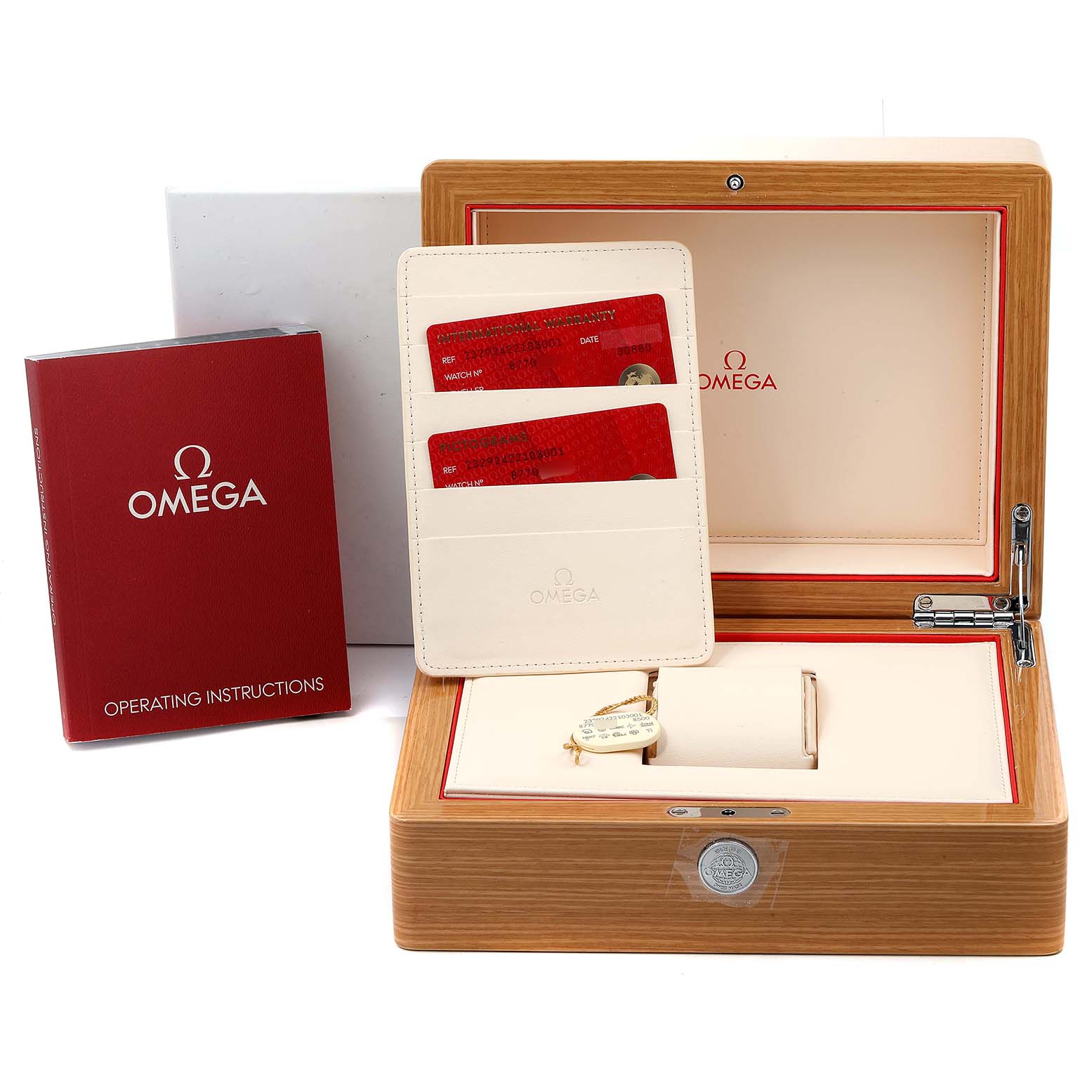 The image shows the packaging and accessories for the Omega Planet Ocean 232.92.42.21.03.001 Men's Stainless Steel Blue Dial 232.92.42.21.03.001 Men's Stainless Steel Blue Dial watch, including the box, warranty cards, and operating instructions.