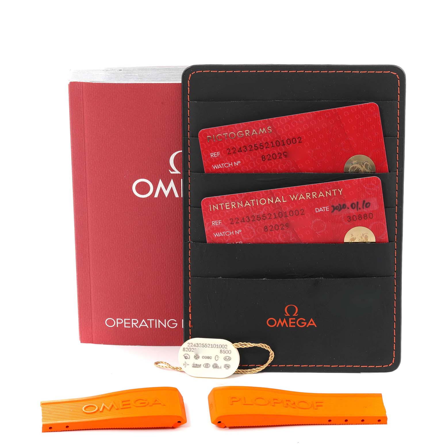 The image shows an Omega Ploprof 224.32.55.21.01.002 Men's Stainless Steel Black Dial 224.32.55.21.01.002 Men's Stainless Steel Black Dial model's operating instructions, warranty cards in a holder, and orange strap accessories.