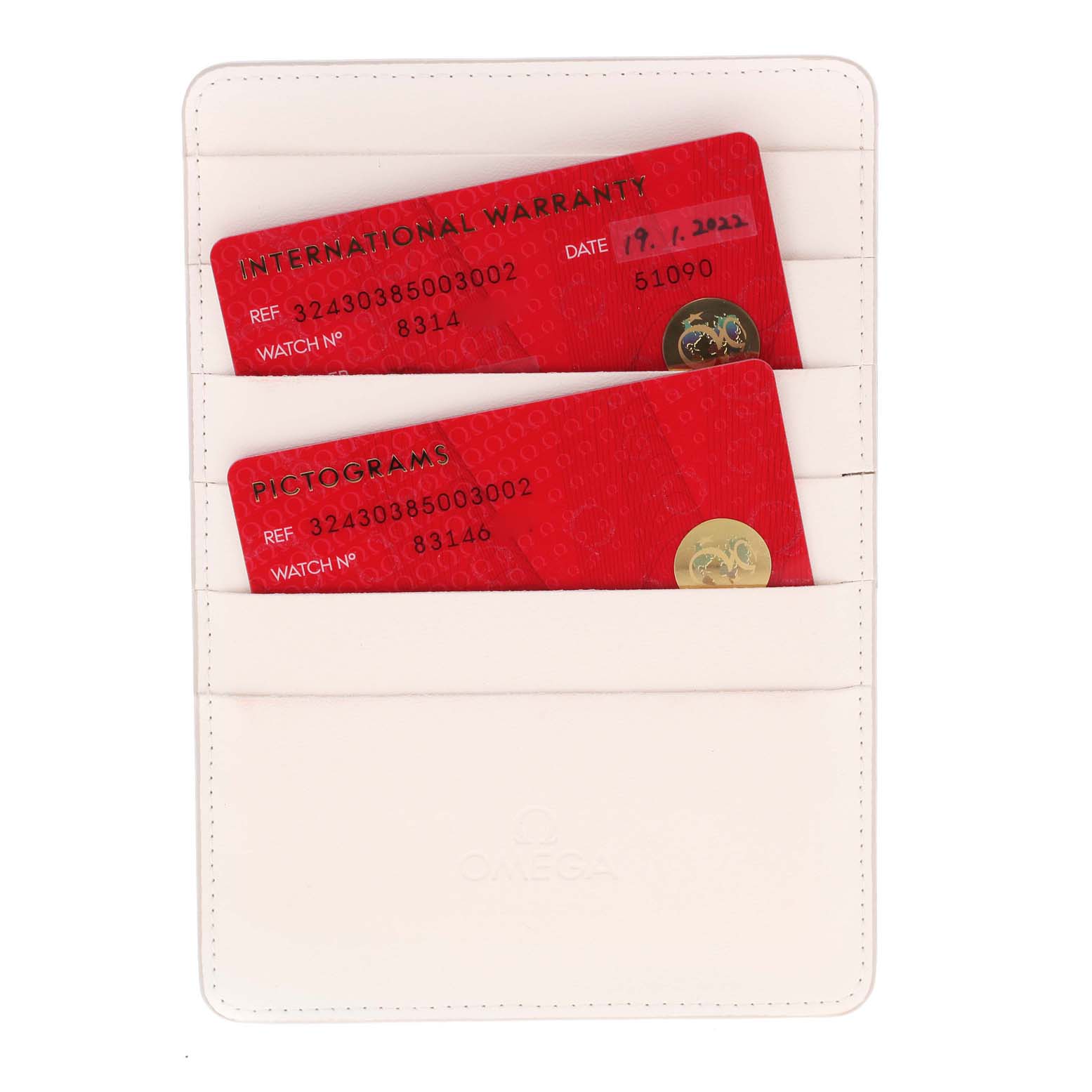 The image shows the warranty and pictogram cards for an Omega Speedmaster 324.30.38.50.03.002 Men's Stainless Steel Blue Dial 324.30.38.50.03.002 Men's Stainless Steel Blue Dial watch, placed inside a white cardholder.