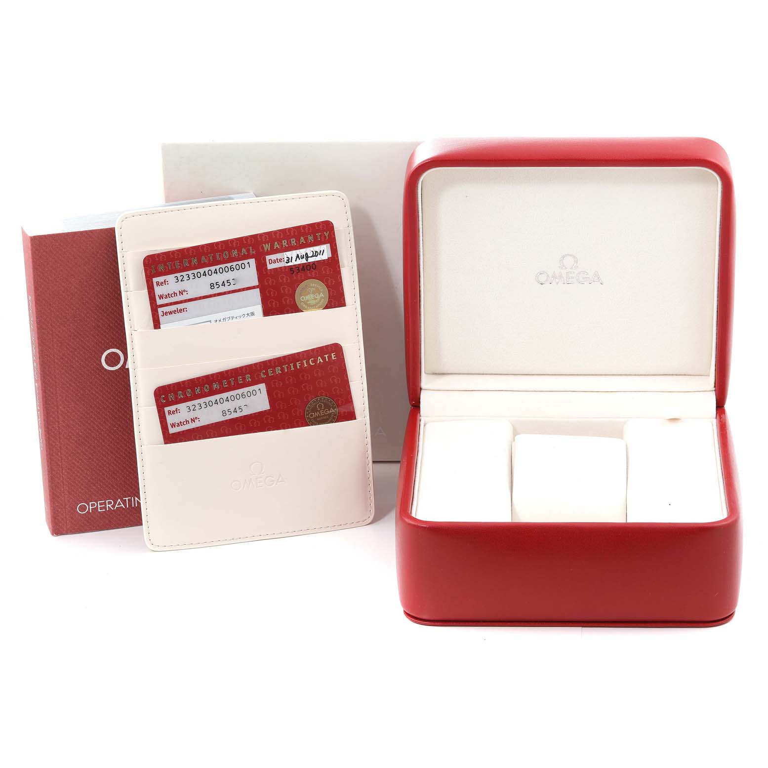 The image shows an Omega Speedmaster 323.30.40.40.06.001 Men's Stainless Steel Grey Dial 323.30.40.40.06.001 Men's Stainless Steel Grey Dial model watch box, warranty cards, and an operating manual.