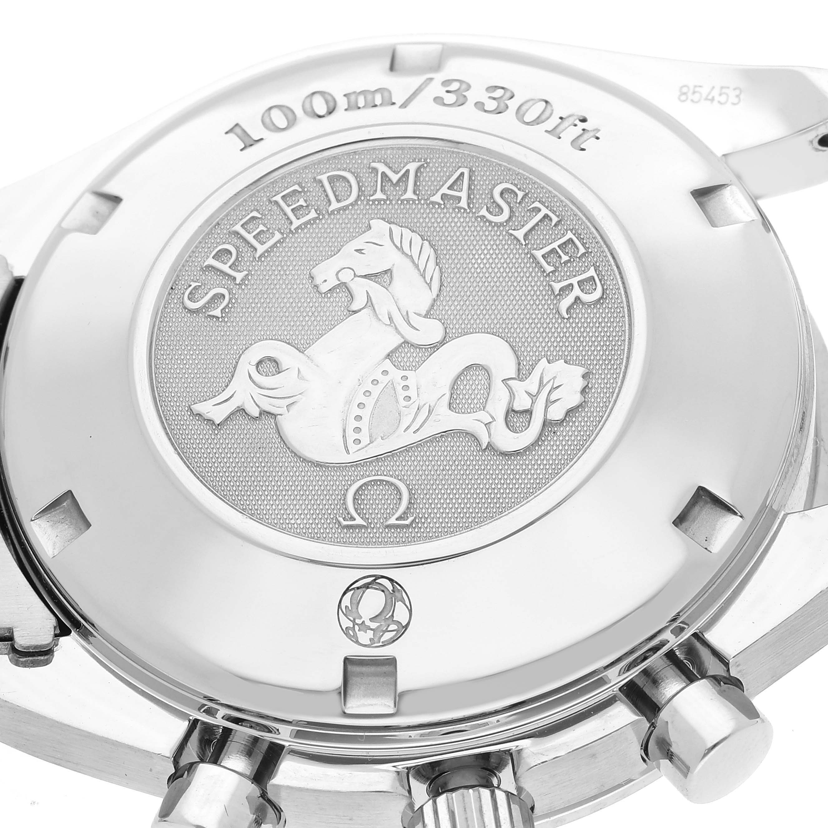 This image shows the backside of an Omega Speedmaster 323.30.40.40.06.001 Men's Stainless Steel Grey Dial 323.30.40.40.06.001 Men's Stainless Steel Grey Dial watch, highlighting its engraved case back and part of the crown.