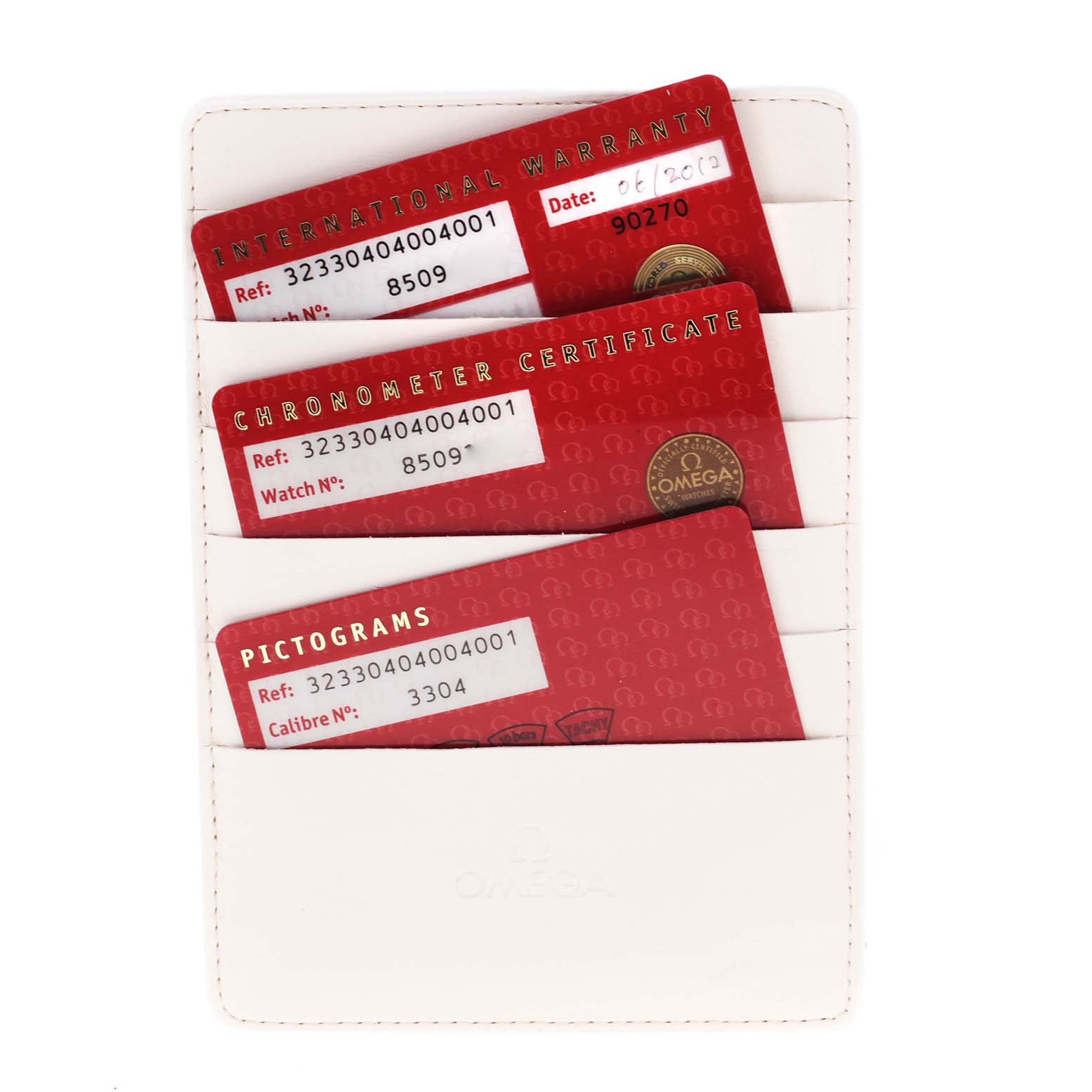 The image shows three warranty and certification cards for an Omega Speedmaster 323.30.40.40.04.001 Men's Stainless Steel White Dial 323.30.40.40.04.001 Men's Stainless Steel White Dial watch, held in a white cardholder.