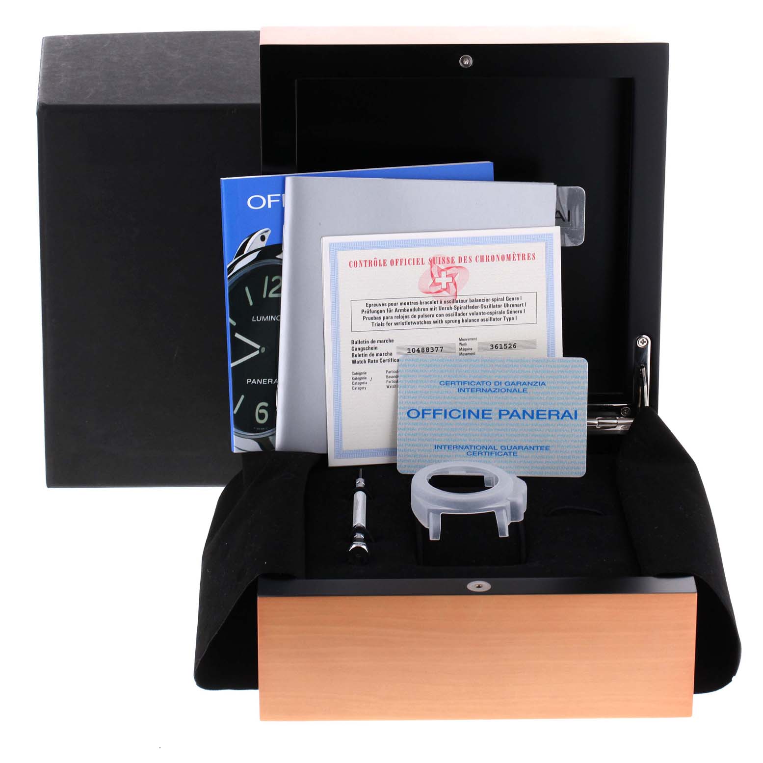 The image shows accessories for the Panerai Luminor PAM00113 Men
s Stainless Steel White Dial PAM00113 Men
s Stainless Steel White Dial watch, including documents, a tool, and a watch part, displayed in a box.