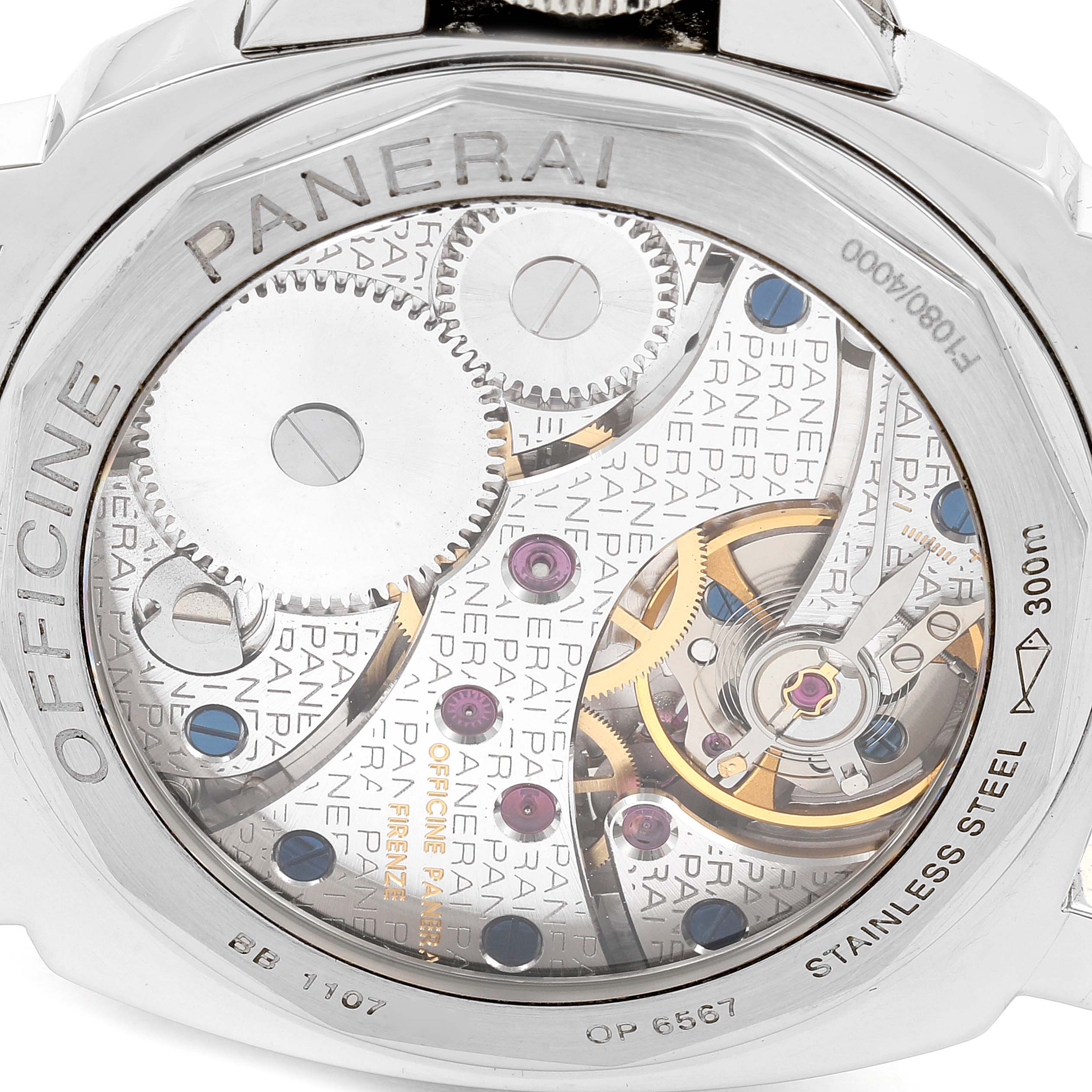 The image shows the back of a Panerai Luminor PAM00113 Men
s Stainless Steel White Dial PAM00113 Men
s Stainless Steel White Dial watch, highlighting the intricate mechanical movement with visible gears.
