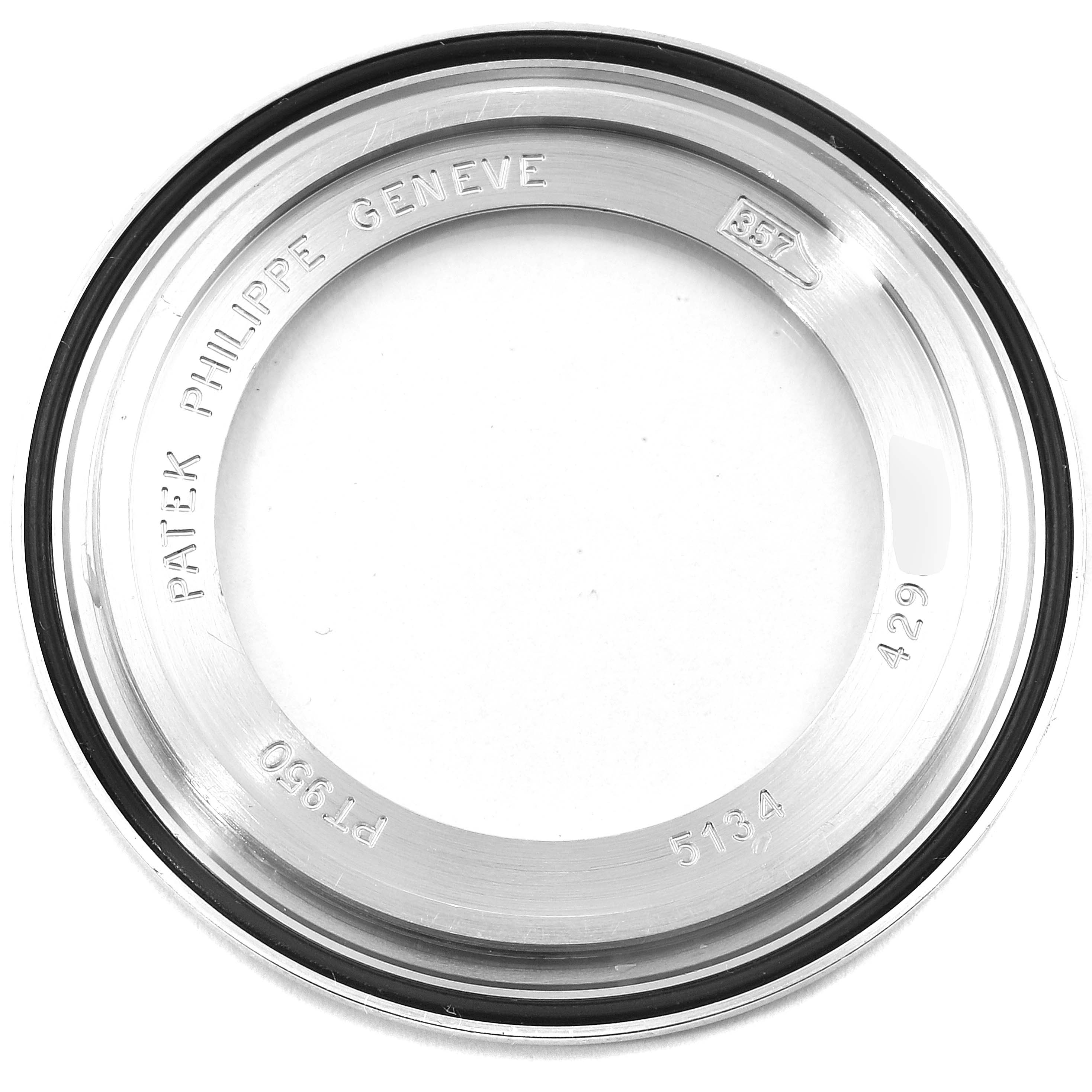 This image shows the case back of a Patek Philippe Calatrava 5134P Men's Platinum Silver Dial 5134P Men's Platinum Silver Dial model watch, displaying inscriptions and serial numbers.