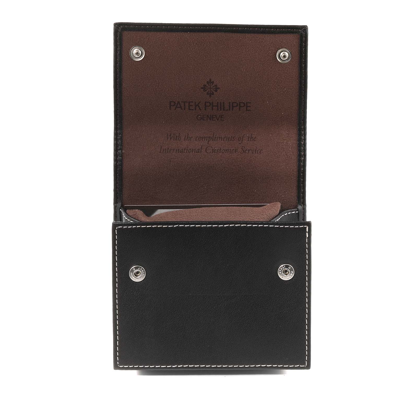 The image shows an open case for a Patek Philippe Gondolo 4972/1G-001 Women's White Gold Mother of Pearl Dial 4972/1G-001 Women's White Gold Mother of Pearl Dial watch, displaying the brand's logo and message inside.