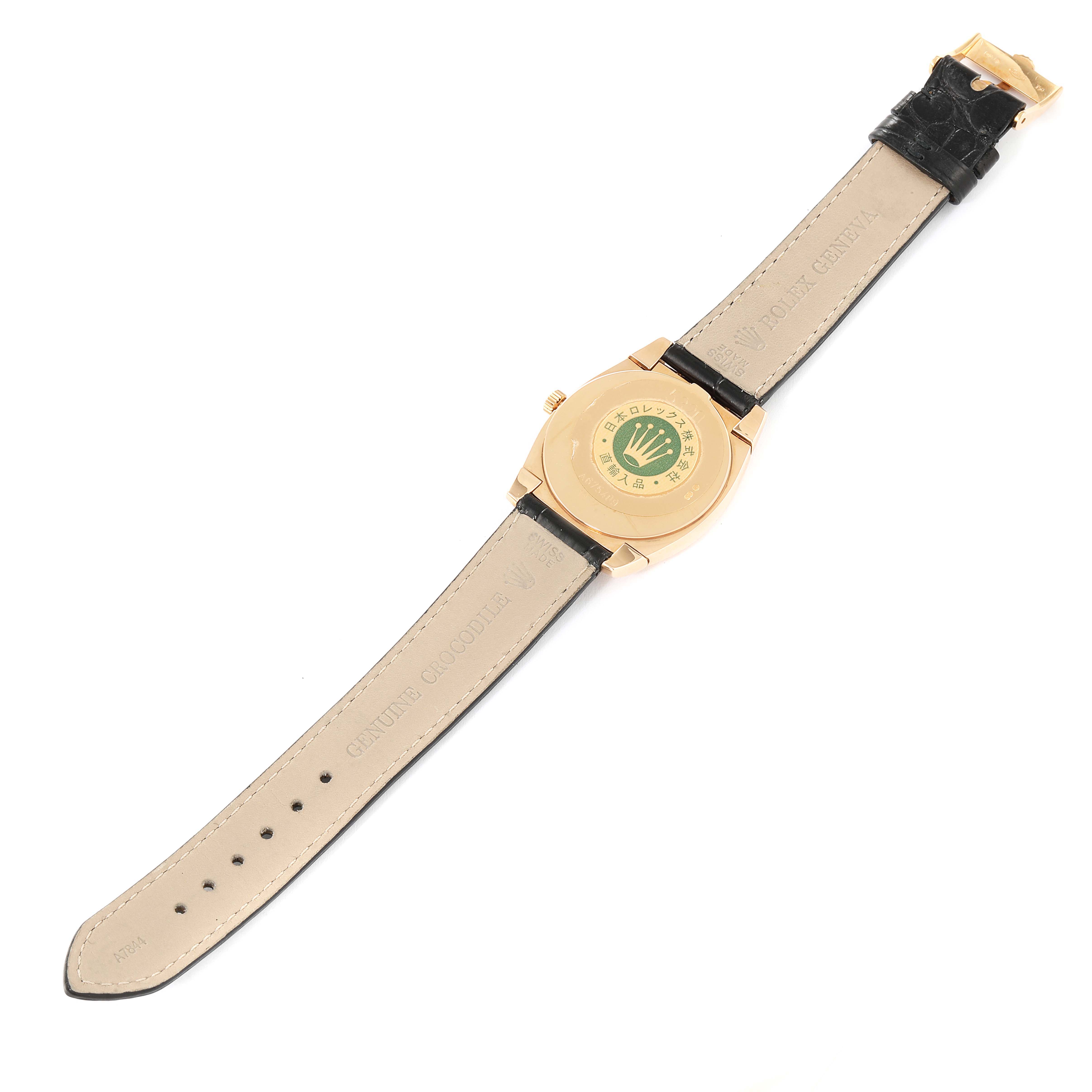 The image shows the back of a Rolex Cellini 5330 Women's Rose Gold White Dial 5330 Women's Rose Gold White Dial watch and its straps, displaying the branding and leather material.