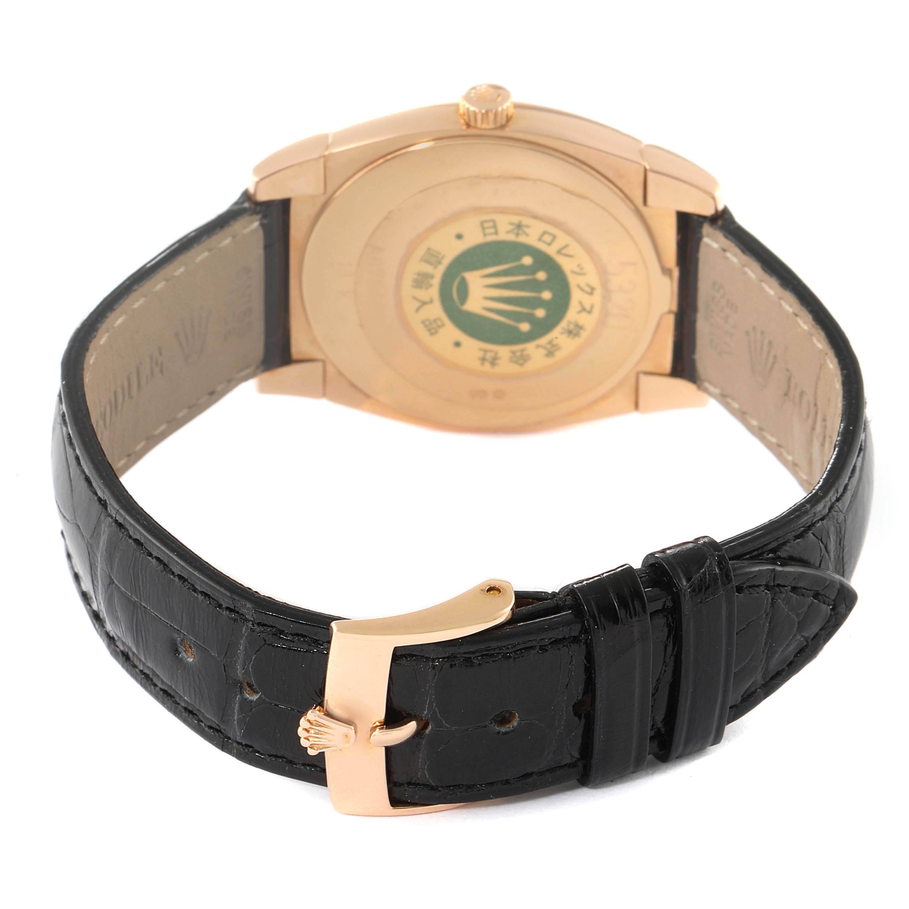 The image shows the back view of a Rolex Cellini 5330 Women's Rose Gold White Dial 5330 Women's Rose Gold White Dial watch, highlighting the clasp, black leather strap, and case back.