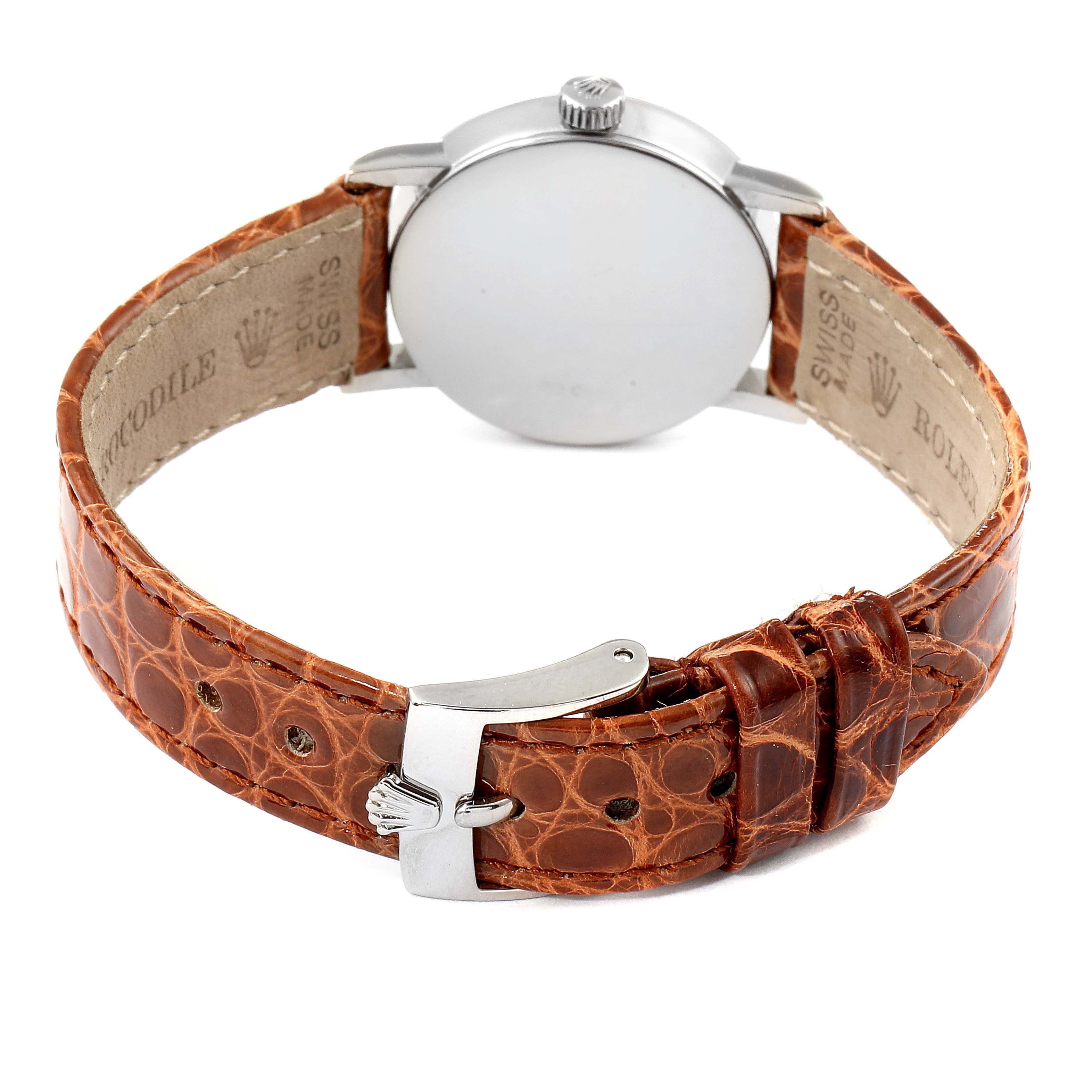 This image shows the back and clasp of a Rolex Cellini 6110 Women's White Gold Silver Dial 6110 Women's White Gold Silver Dial watch with a brown leather strap.