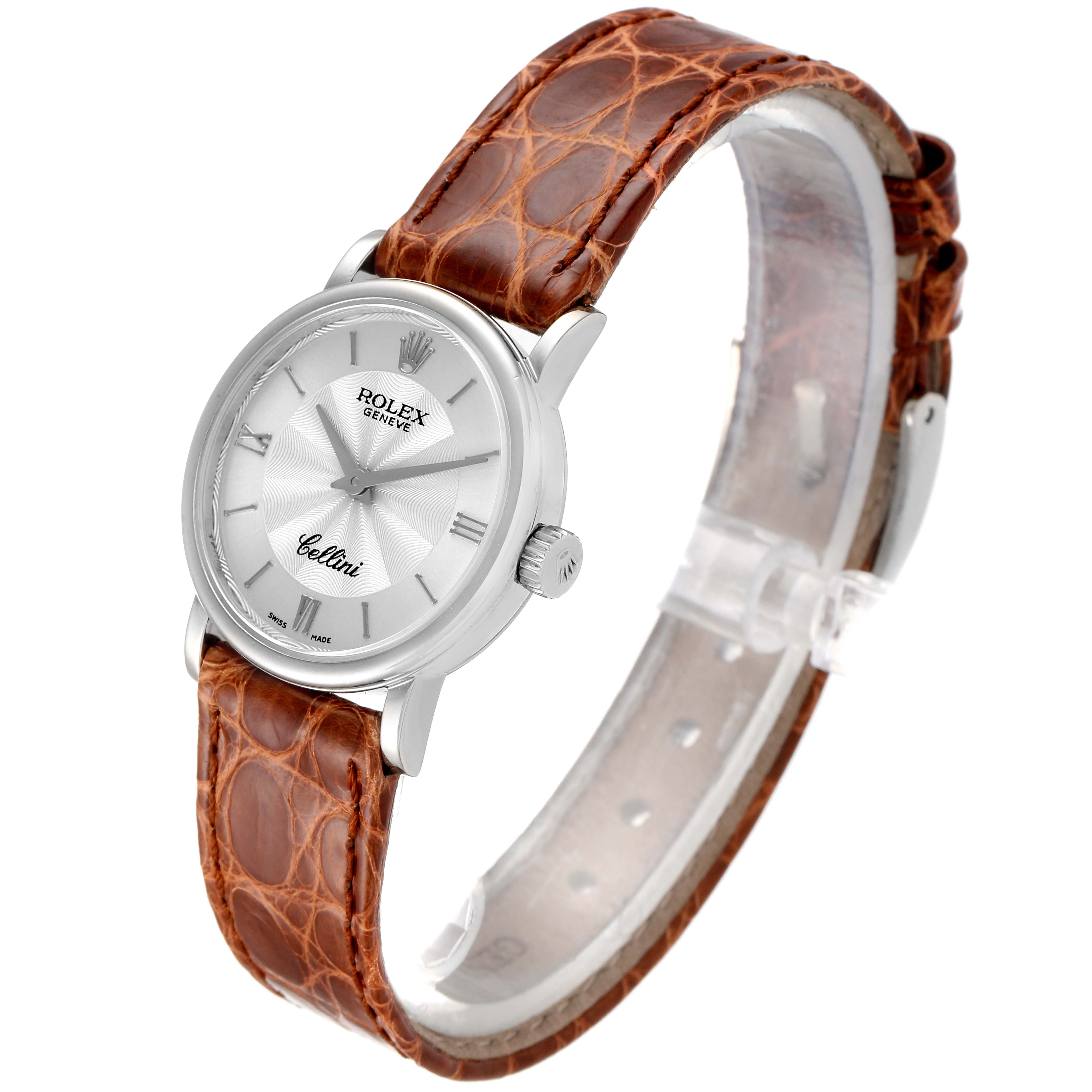 The image shows a Rolex Cellini 6110 Women's White Gold Silver Dial 6110 Women's White Gold Silver Dial watch at a slight angle, featuring a silver dial, Roman numerals, and a brown leather strap.