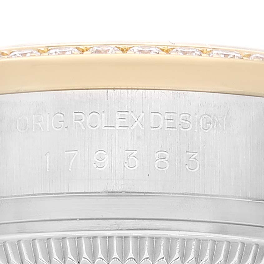 This image shows a close-up of the case side with engravings "ORIG. ROLEX DESIGN" and model number of a Rolex Datejust 179383 Women's Steel and Gold (two tone) Champagne Dial 179383 Women's Steel and Gold (two tone) Champagne Dial watch.