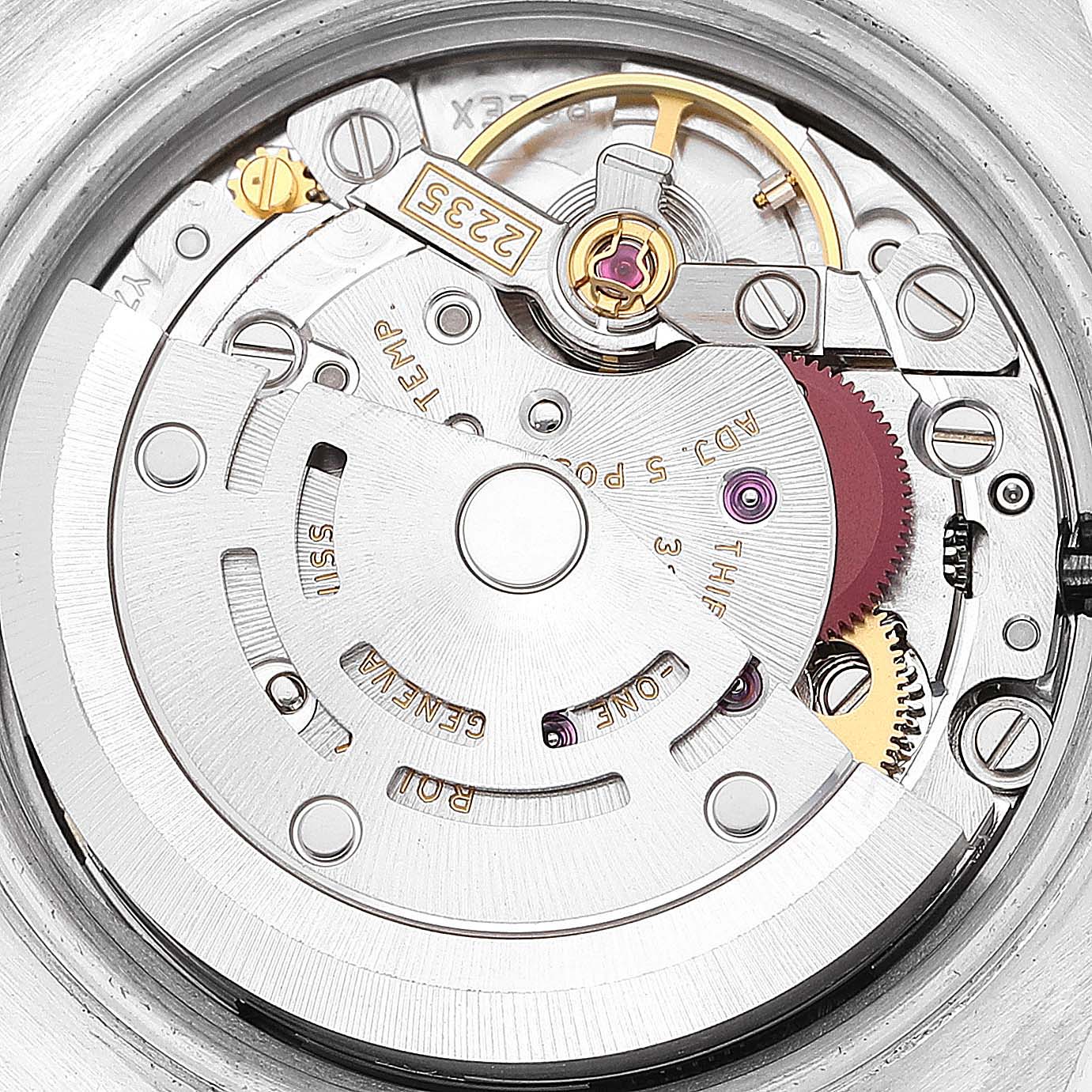 This image shows a close-up view of the Rolex Datejust 179383 Women's Steel and Gold (two tone) Champagne Dial 179383 Women's Steel and Gold (two tone) Champagne Dial movement mechanism, highlighting gears, screws, and the balance wheel.