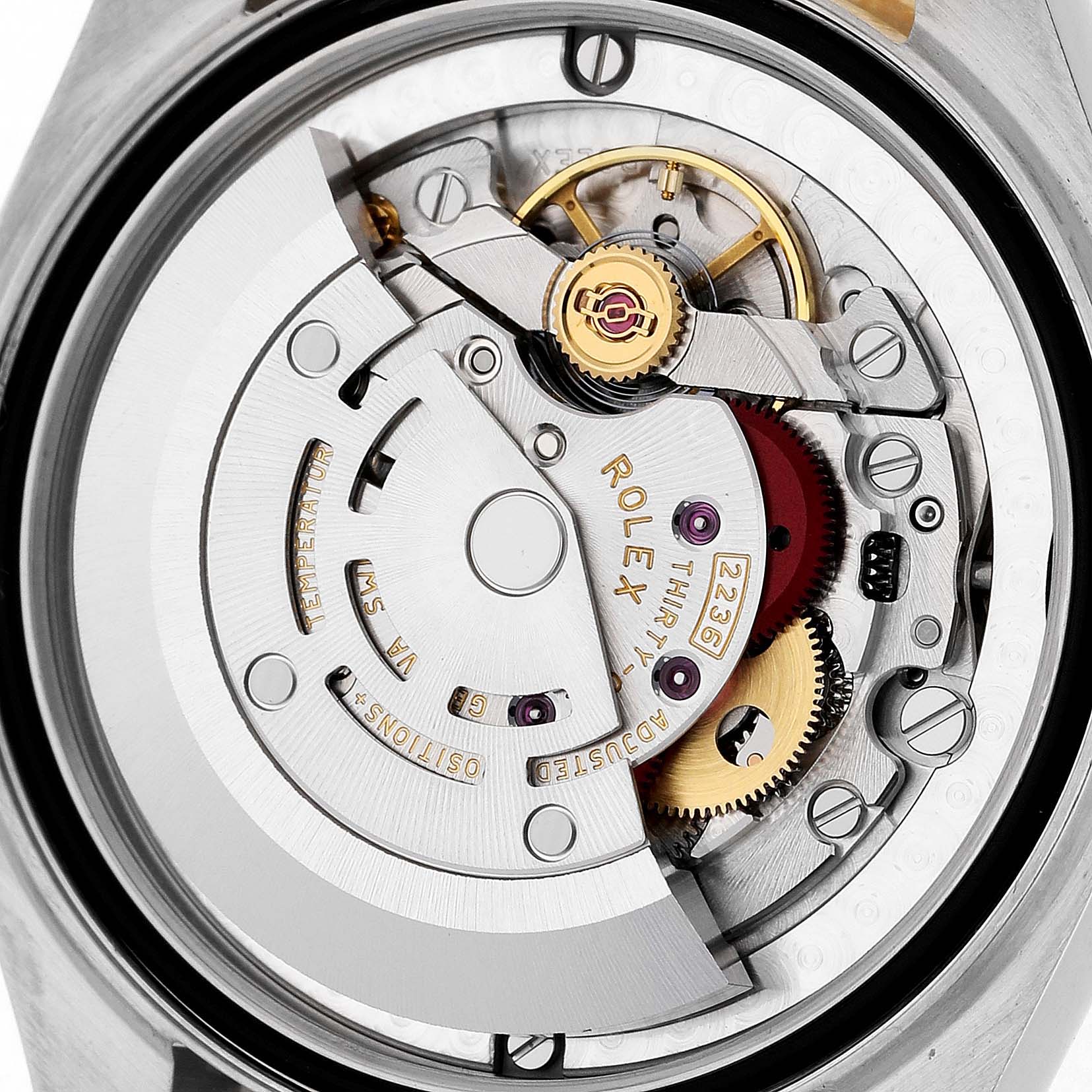 The image shows the internal movement mechanism of a Rolex Mid-Size M278383RBR-0004 Women's Steel and Gold (two tone) Silver Dial watch viewed from the back.