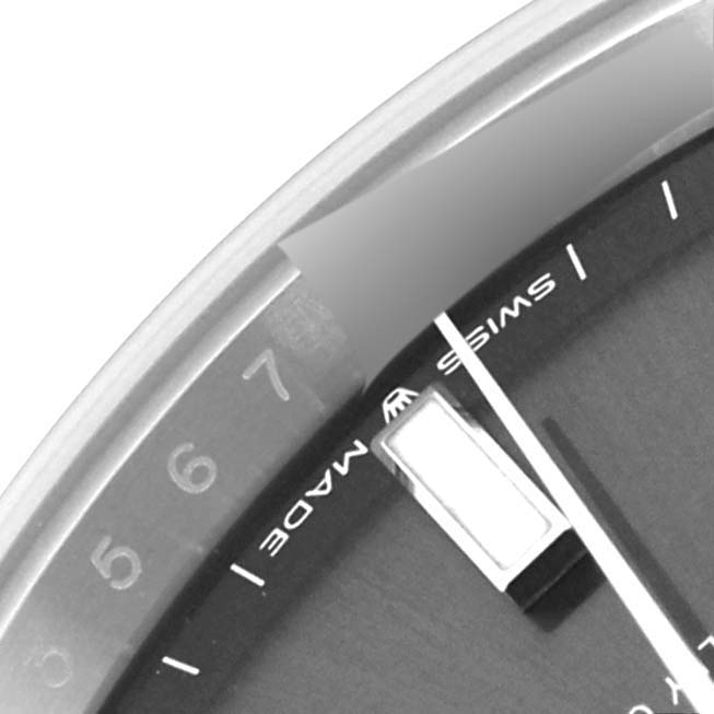 The image shows a close-up of a portion of the dial and bezel of a Rolex Datejust 41 126300 Men's Stainless Steel Grey Dial 126300 Men's Stainless Steel Grey Dial, displaying the "Swiss Made" text and hour mark.