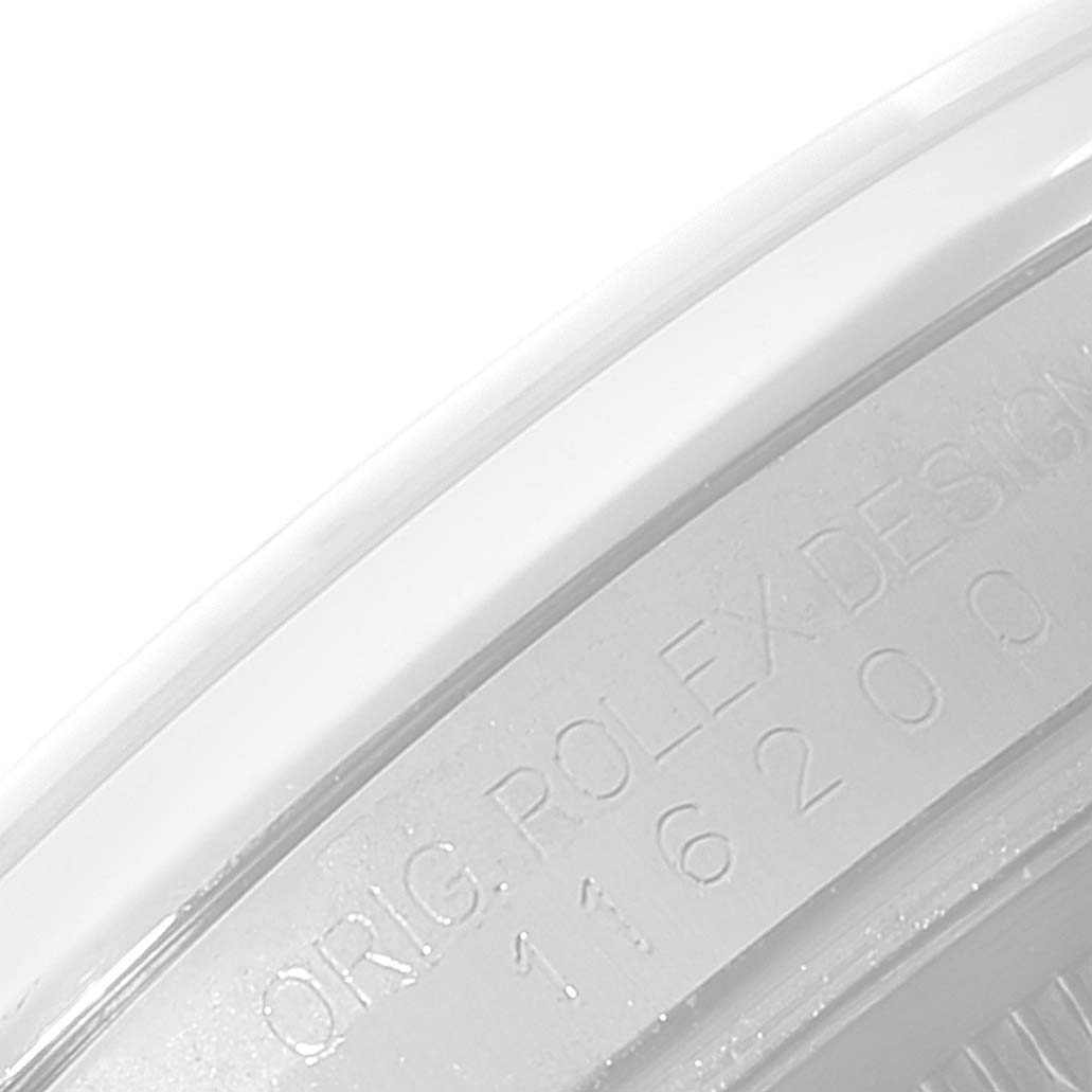 The image shows a close-up of the serial number engraving on the case of a Rolex Datejust 116200 Men
s Stainless Steel Black Dial 116200 Men
s Stainless Steel Black Dial watch.