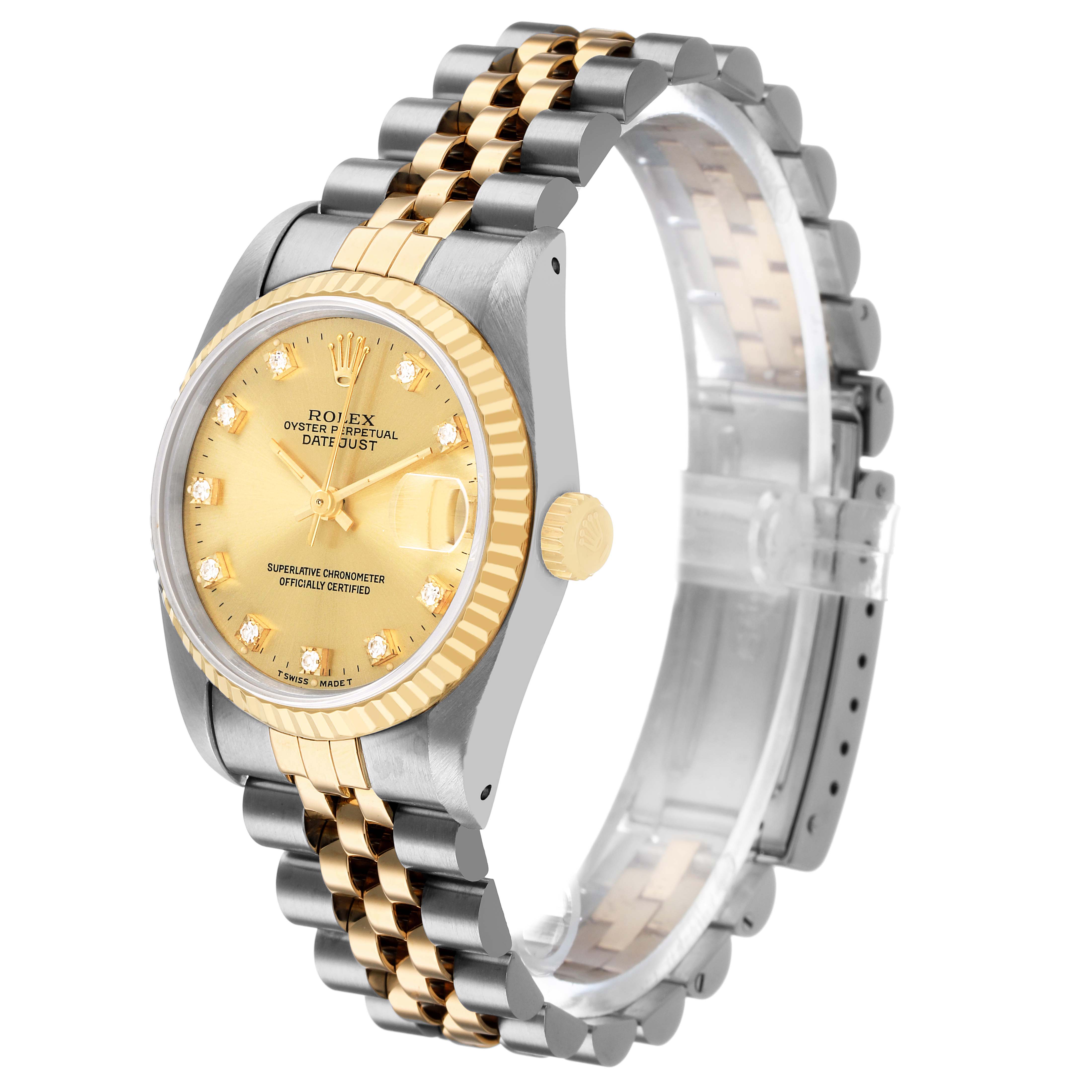 The Rolex Datejust 68273 Women's Steel and Gold (two tone) Champagne Dial watch is shown at a side angle, highlighting the gold and silver bracelet, fluted bezel, and champagne dial.