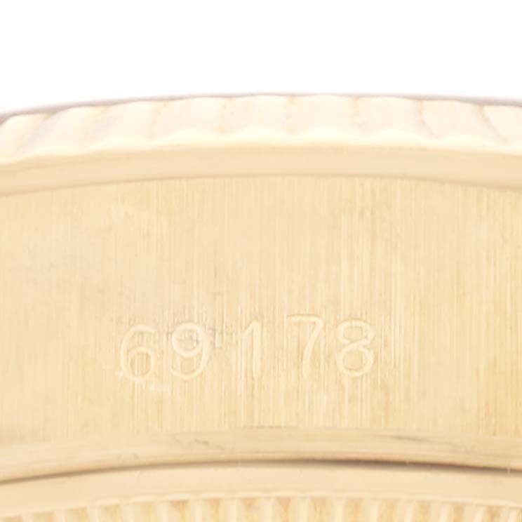 This image shows a close-up angle of the side of a Rolex President 69178 Women's Yellow Gold Black Dial 69178 Women's Yellow Gold Black Dial model watch, focusing on the engraved model number 69178.