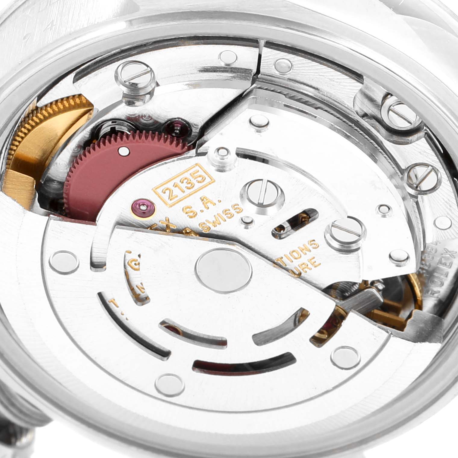 The image shows an up-close view of the inner mechanical movement of a Rolex Datejust 69174 Women's Stainless Steel Black Dial 69174 Women's Stainless Steel Black Dial watch, specifically the rotor and gears.