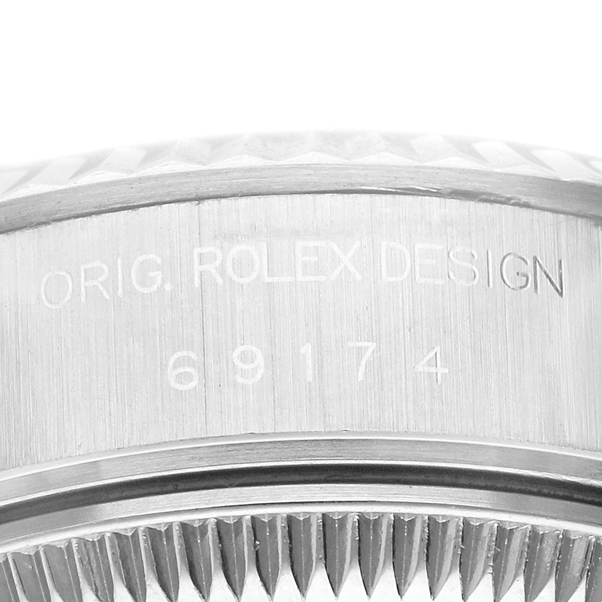 The image shows a close-up view of the side case and bezel with the engraved model number of the Rolex Datejust 69174 Women's Stainless Steel Pink Dial.