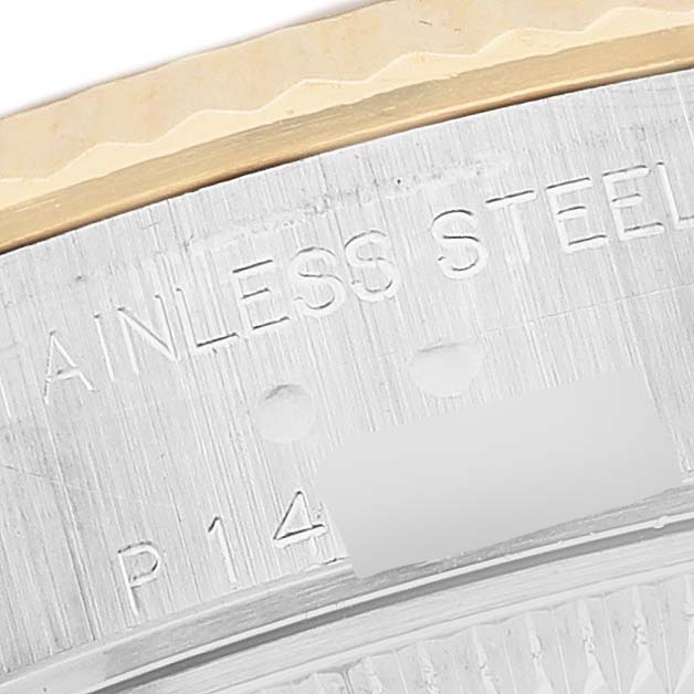 The image shows a close-up of the Rolex Datejust 79173 Women's Stainless Steel Black Dial's side, highlighting the stainless steel inscription and part of the bezel.