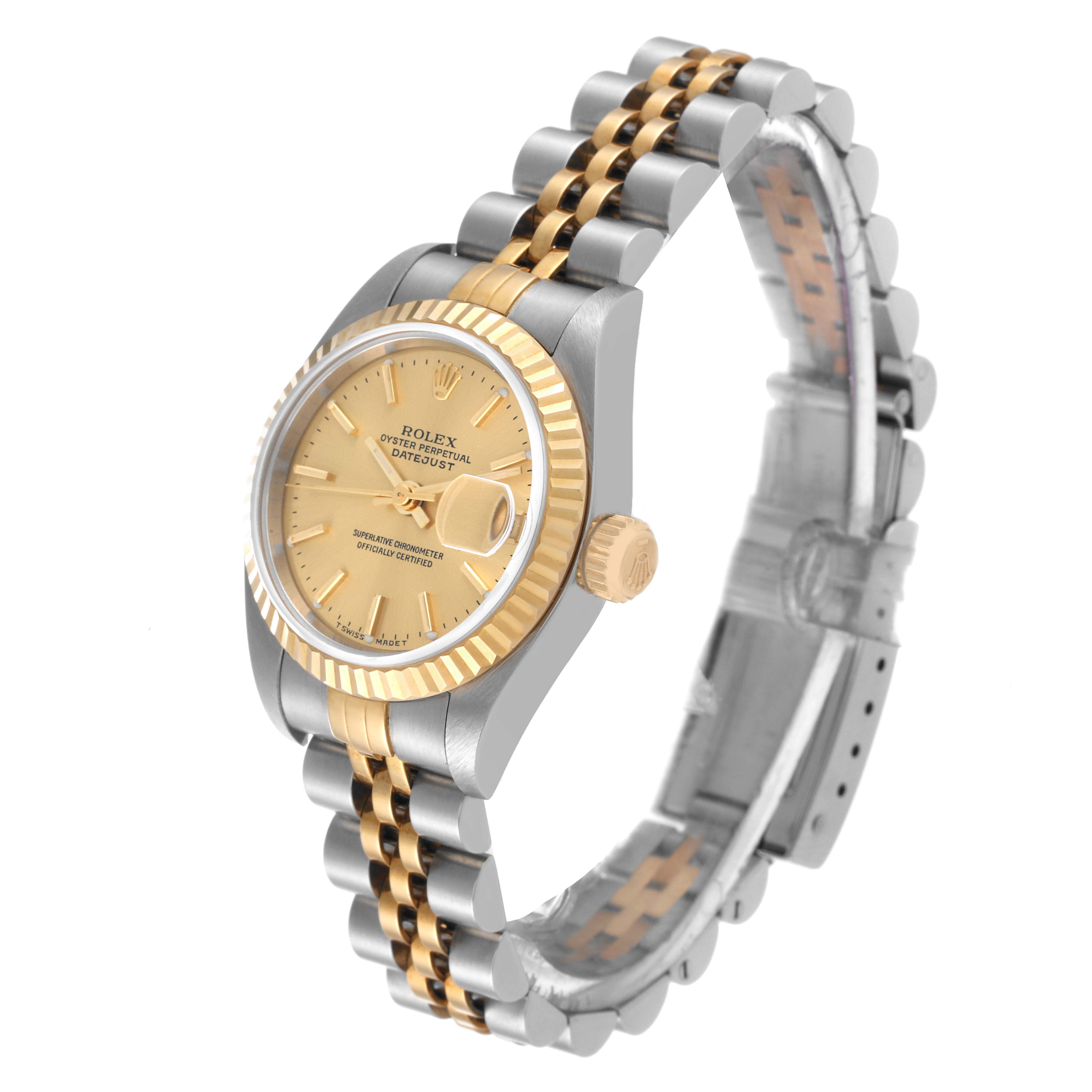 This image shows a Rolex Datejust 79173 Women's Steel and Gold (two tone) Champagne Dial 79173 Women's Steel and Gold (two tone) Champagne Dial watch at an angle highlighting its gold and silver bracelet, dial, bezel, and crown.