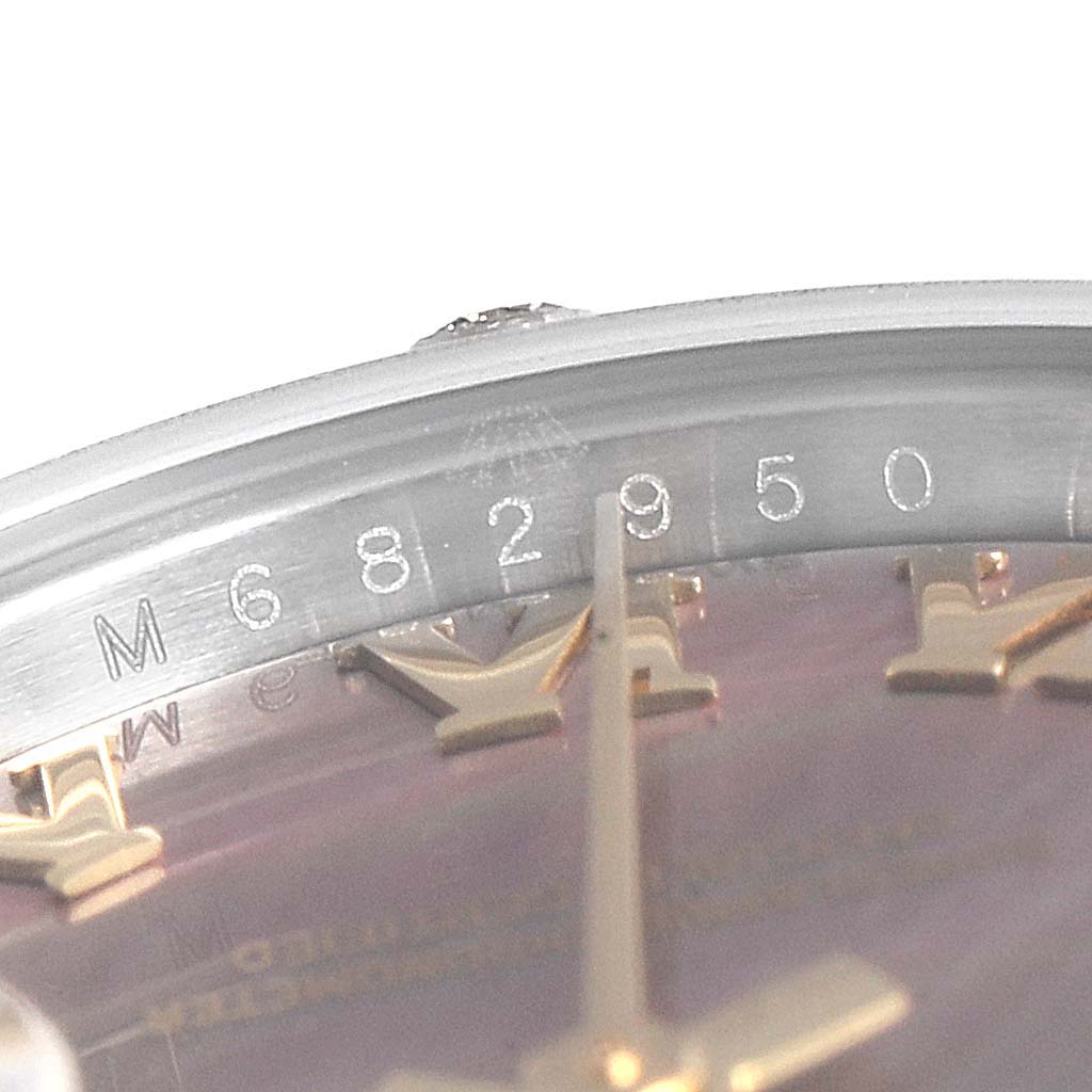 The image shows a close-up of the bezel and part of the dial of a Rolex Datejust 179313 Women
s Steel and Gold (two tone) Mother of Pearl Dial 179313 Women
s Steel and Gold (two tone) Mother of Pearl Dial watch, highlighting the serial number.