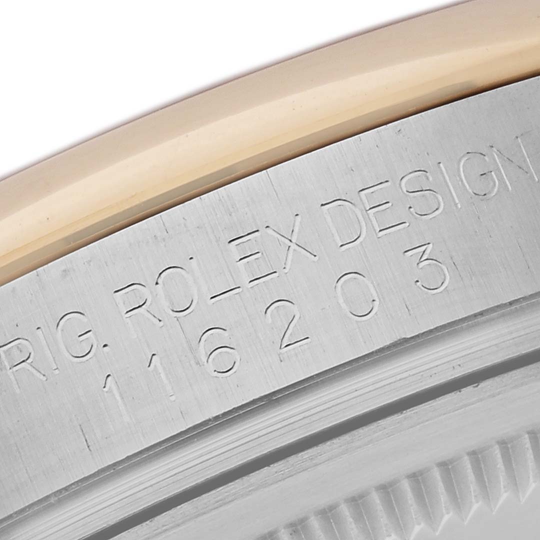 This image shows a close-up of the case side and bezel edge of a Rolex Datejust 116203 Men's Steel and Gold (two tone) Grey Dial 116203 Men's Steel and Gold (two tone) Grey Dial watch, highlighting engraved model numbers.