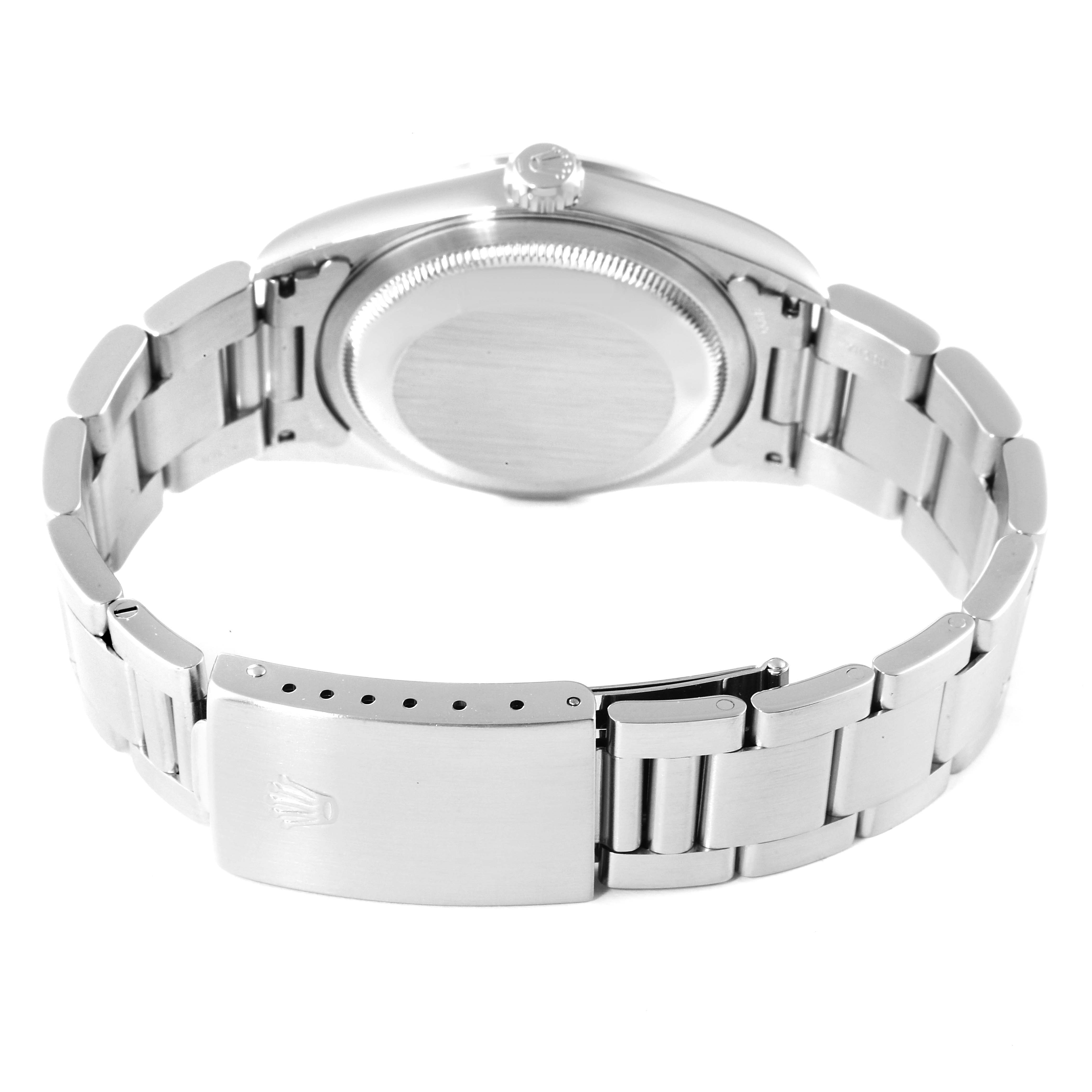 The image shows the back view of a Rolex Datejust 16200 Men's Stainless Steel White Dial 16200 Men's Stainless Steel White Dial watch, displaying its closed case back and metal bracelet with the clasp.