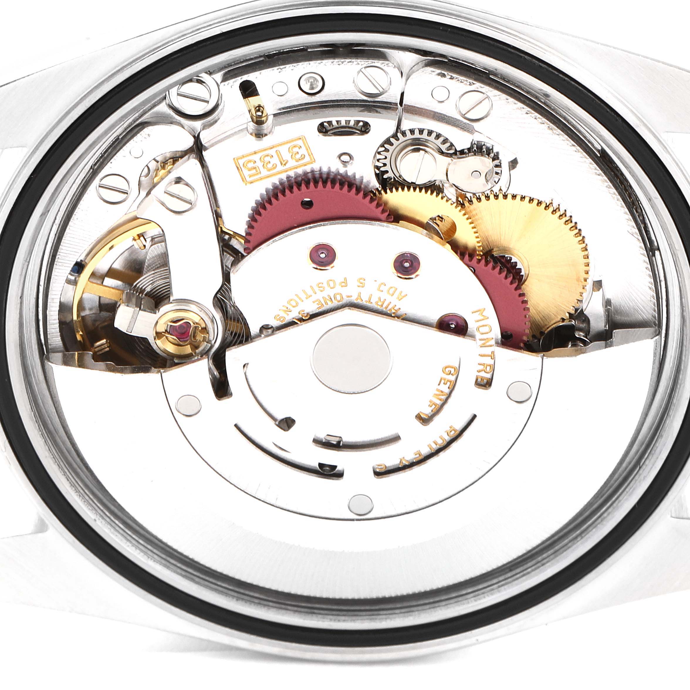 This is a macro view of the internal mechanism of a Rolex Datejust 16200 Men's Stainless Steel White Dial 16200 Men's Stainless Steel White Dial watch showing gears, cogs, and the rotor.