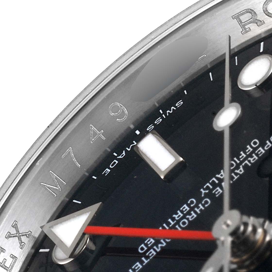 The image shows a close-up of the dial and bezel of a Rolex Explorer 16570 Men
s Stainless Steel Black Dial 16570 Men
s Stainless Steel Black Dial watch, including the hour hand with a red accent.