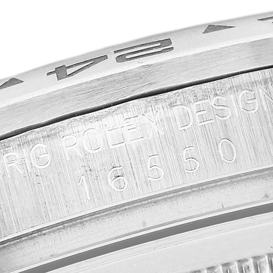The image shows a close-up of the side engraving of a Vintage Collection model by Rolex, showcasing the serial number and design engraving.