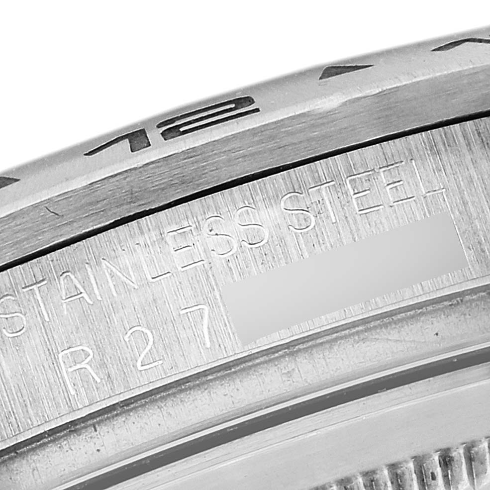 This close-up image shows the engraved bezel and stainless steel casing of a Rolex Vintage Collection 16550 Men's Stainless Steel Beige Dial 16550 Men's Stainless Steel Beige Dial watch.